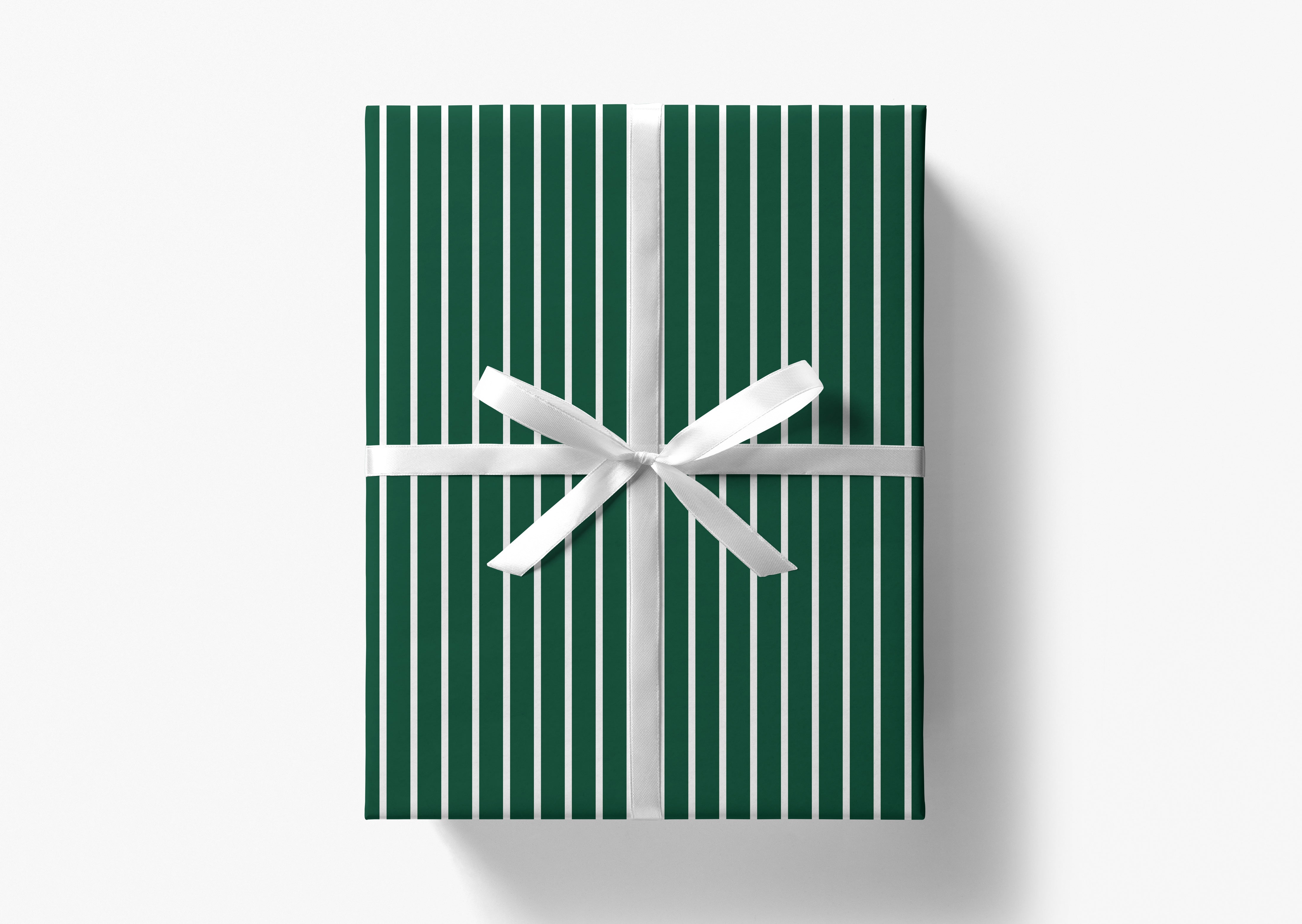 A green gift box with a white ribbon tied in a bow, set against a white background.