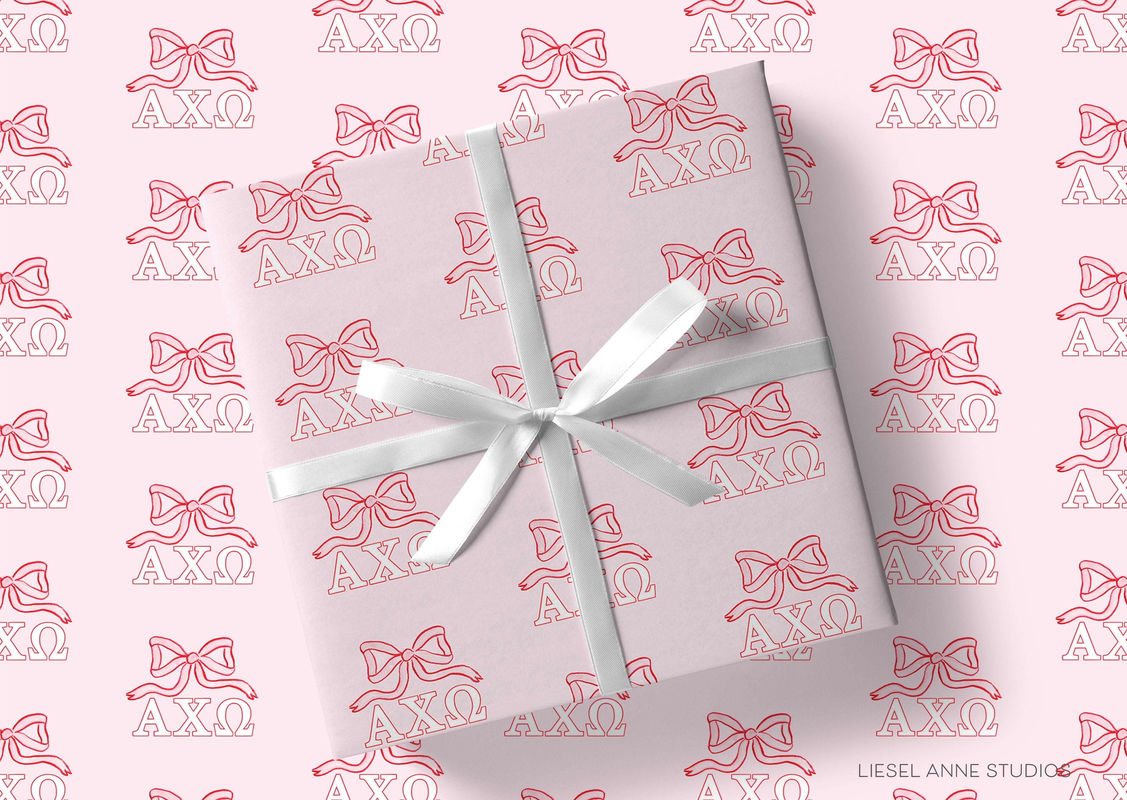 Alpha Chi Omega Pink Bow Gift Wrap-This matte finish gift wrap features our hand-painted watercolor pink and red bows and 
Alpha Chi Omega greek letters. It makes a perfect wrapping paper for any celebration present for an A Chi-O sister. -The Singing Little Bird