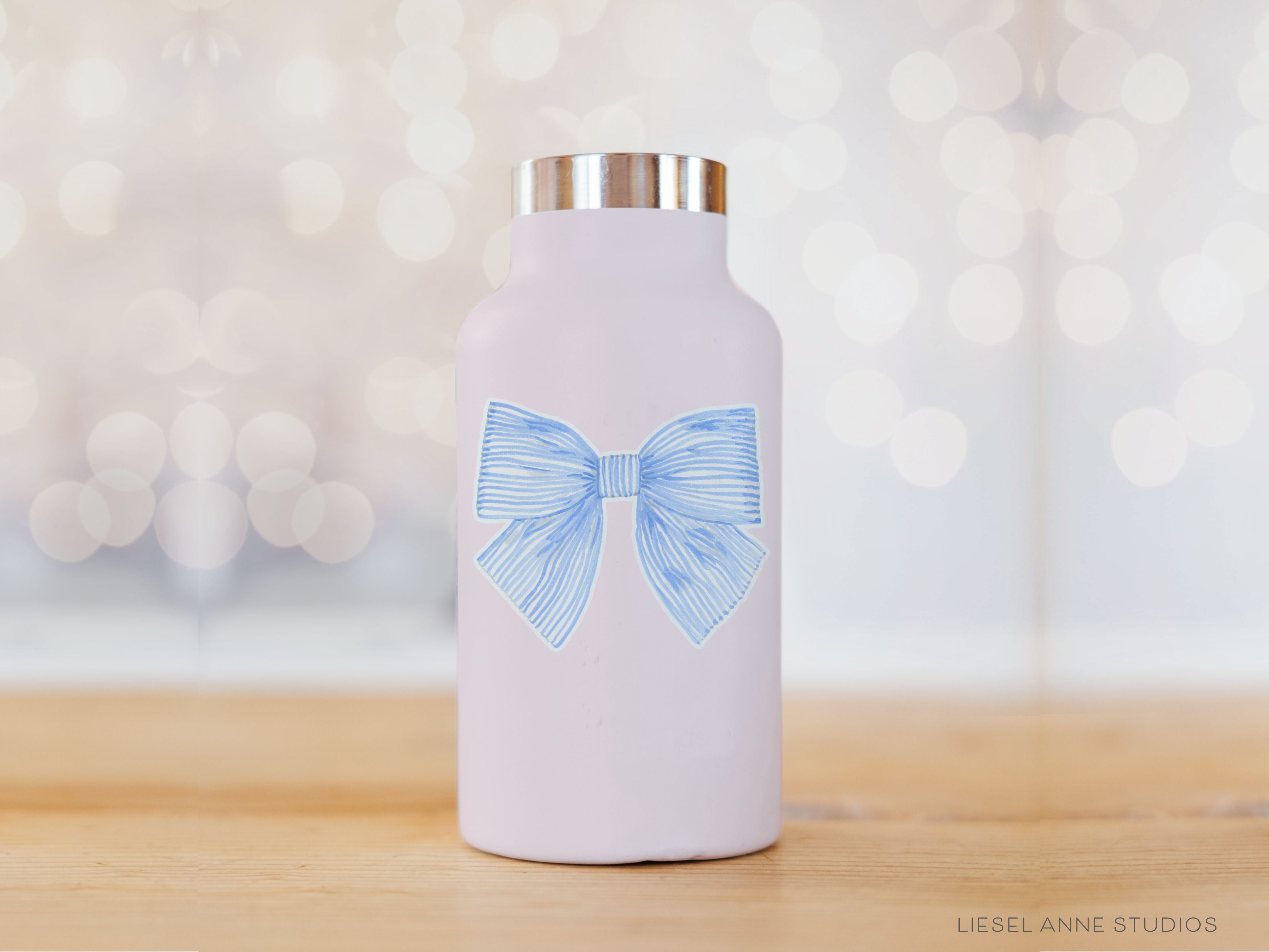 Blue Striped Bow Vinyl Sticker-These weatherproof die cut stickers feature our hand-painted watercolor striped blue bow, making great laptop or water bottle stickers or gifts for the bow lover in your life.-The Singing Little Bird
