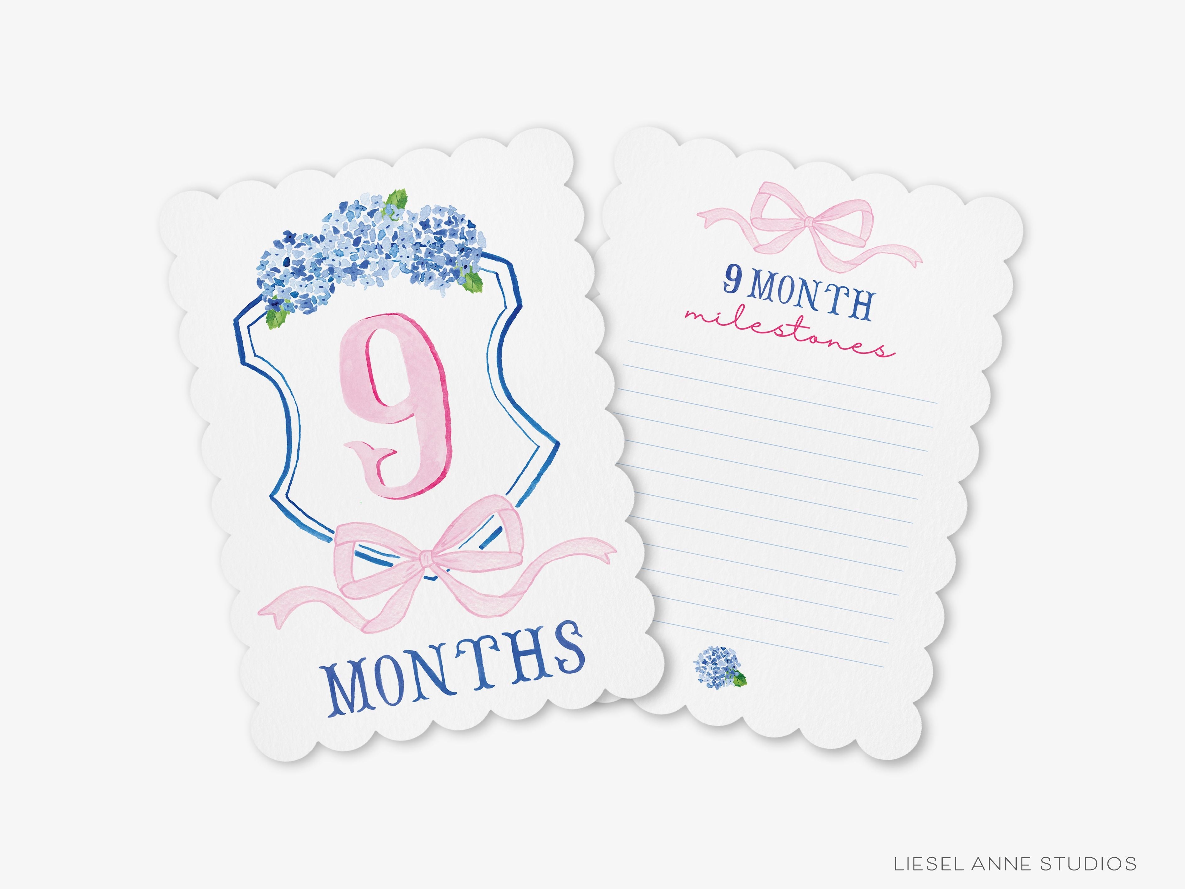 Blue and Pink Crest Scalloped Monthly Milestone Cards-These scalloped flat notecards are 5x7 and feature our hand-painted watercolor Hydrangea crest and pink bow and monthly milestone tracker, printed in the USA on 120lb textured stock. They make the perfect way to remember your baby's first year of milestones!-The Singing Little Bird