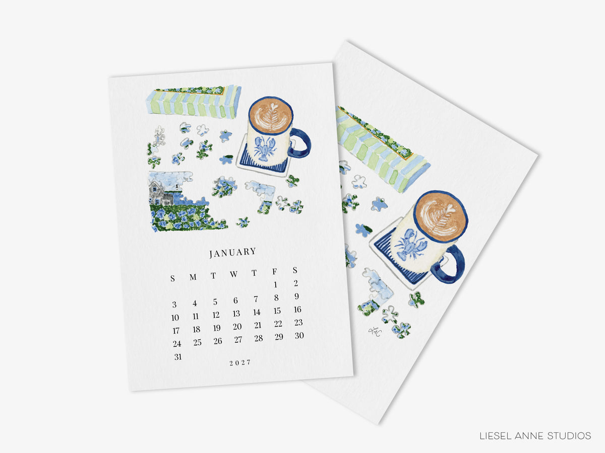 January puzzle page of the Happy Hobbies 2027 desk calendar with its art print back, a gift for puzzle lovers