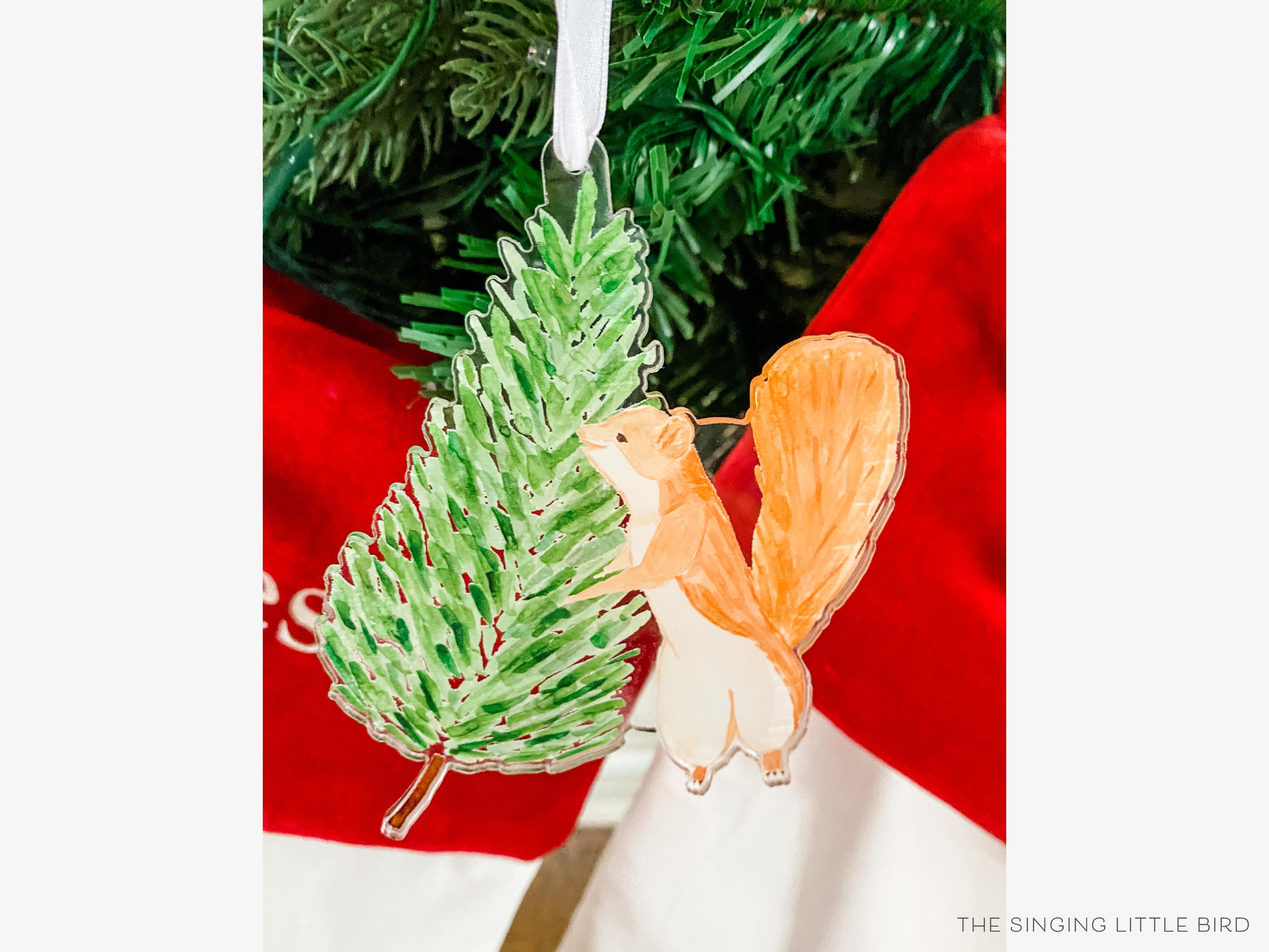 Earl The Tree Squirrel Acrylic Ornament-These acrylic ornaments feature our hand-painted watercolor squirrel and evergreen tree. They include a white silk ribbon and measure approximately 4" on its longest side, making a great addition to your Christmas tree or gift for the animal lover in your life.-The Singing Little Bird