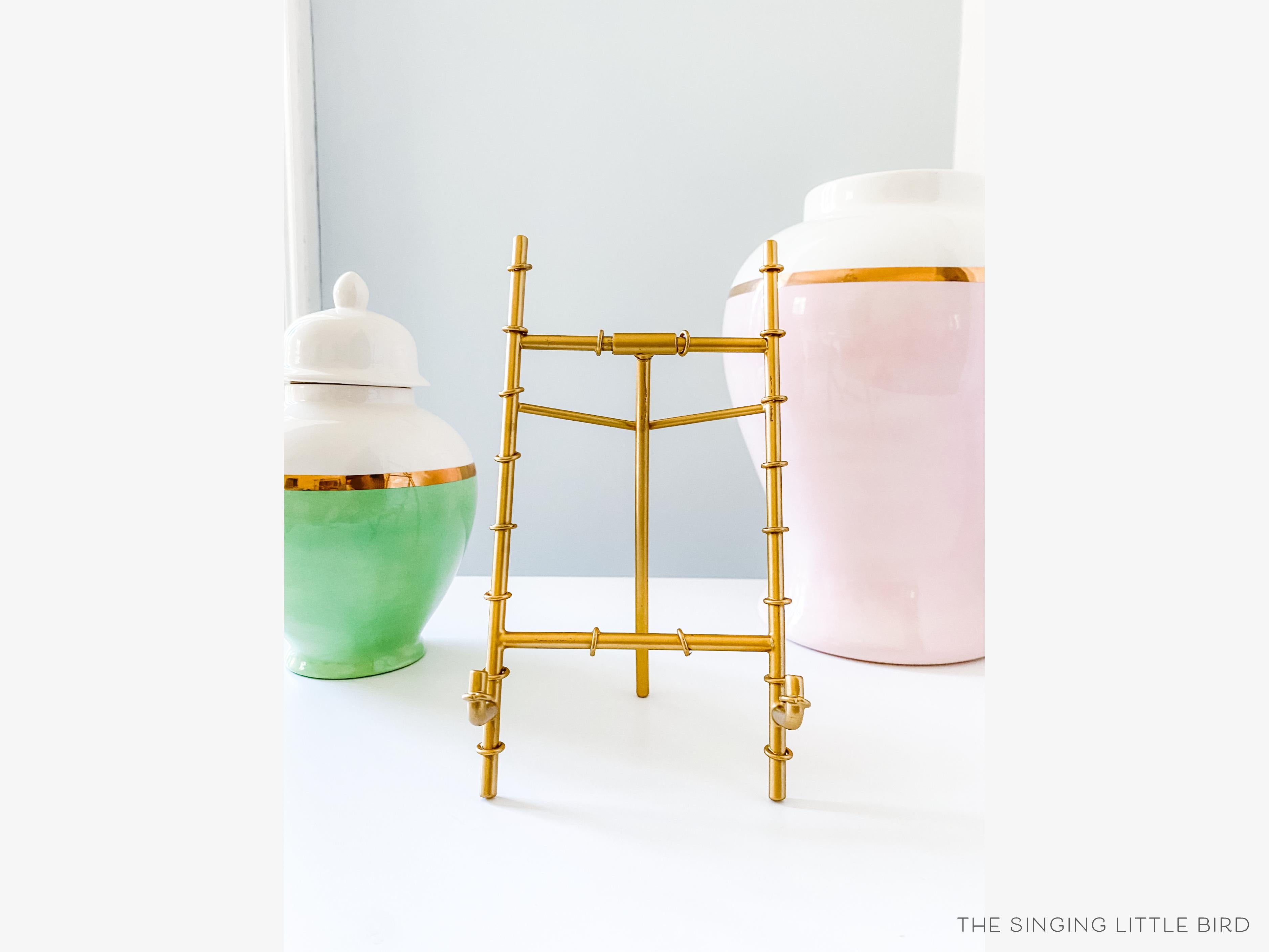 Gold Bamboo Easel-• Gold Metal Bamboo Easel
• Makes for a great display stand for calendars and 5x7 Art Prints
• Measures 4" wide x 8" tall-The Singing Little Bird
