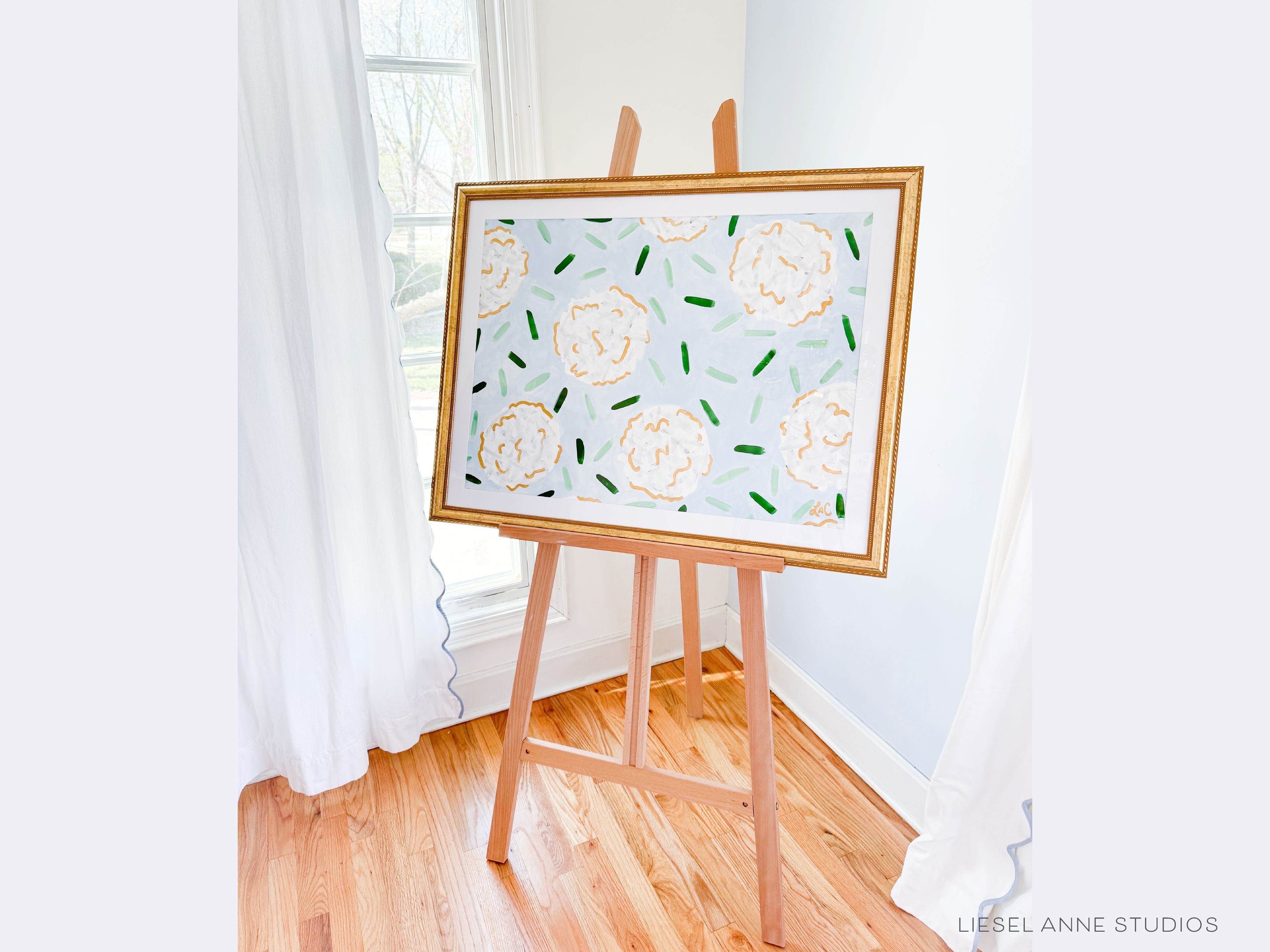 Golden Hydrangea | Blue & White III-Original artwork measures 22"x30"" | Hand-Painted with gouache on cold press watercolor paper | Matted and framed in gold wood frame sized 27 1/4" x 35 1/4" | UV shielding acrylic glass | Hanging hardware included | Features our signature Golden Hydrangea design with a light blue base, white hydrangeas and shimmery gold accents | Initialed in gold by the Liesel Anne (the artist) on the front and signed and dated on the back.-The Singing Little Bird