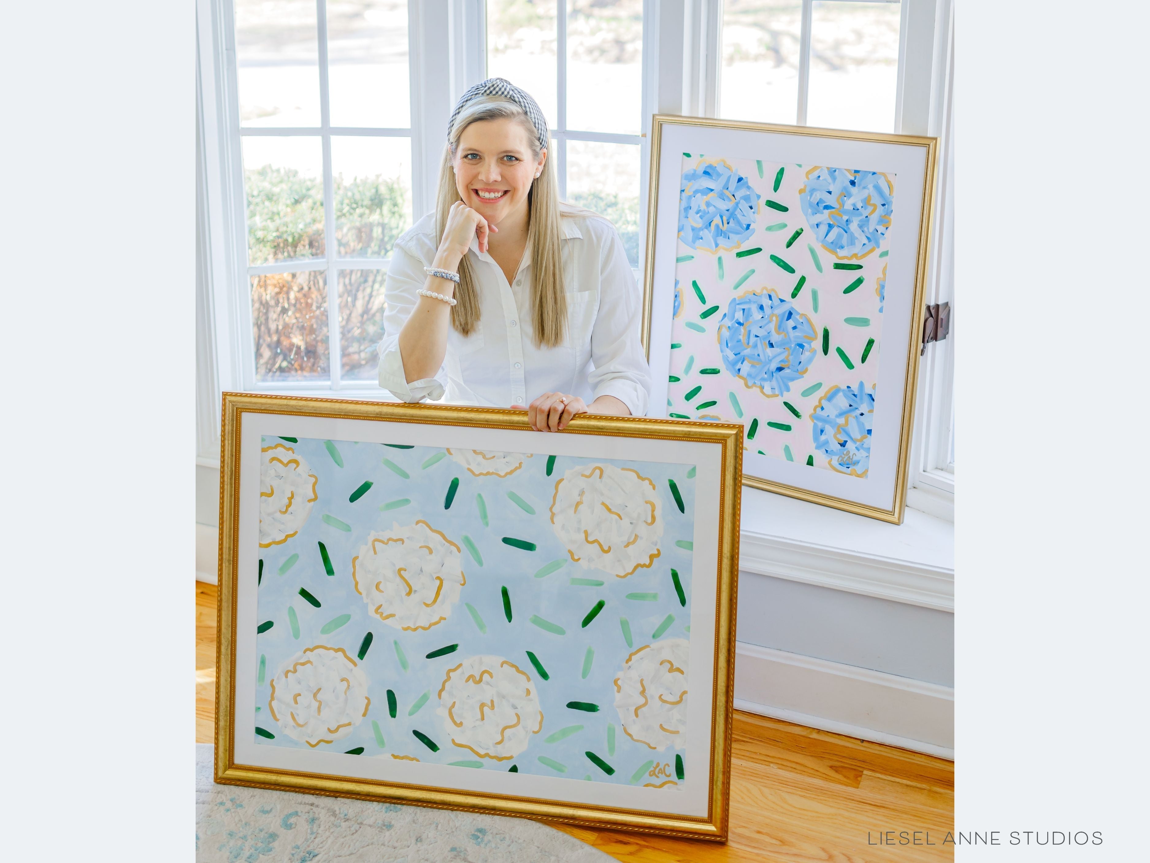 Golden Hydrangea | Blue & White III-Original artwork measures 22"x30"" | Hand-Painted with gouache on cold press watercolor paper | Matted and framed in gold wood frame sized 27 1/4" x 35 1/4" | UV shielding acrylic glass | Hanging hardware included | Features our signature Golden Hydrangea design with a light blue base, white hydrangeas and shimmery gold accents | Initialed in gold by the Liesel Anne (the artist) on the front and signed and dated on the back.-The Singing Little Bird