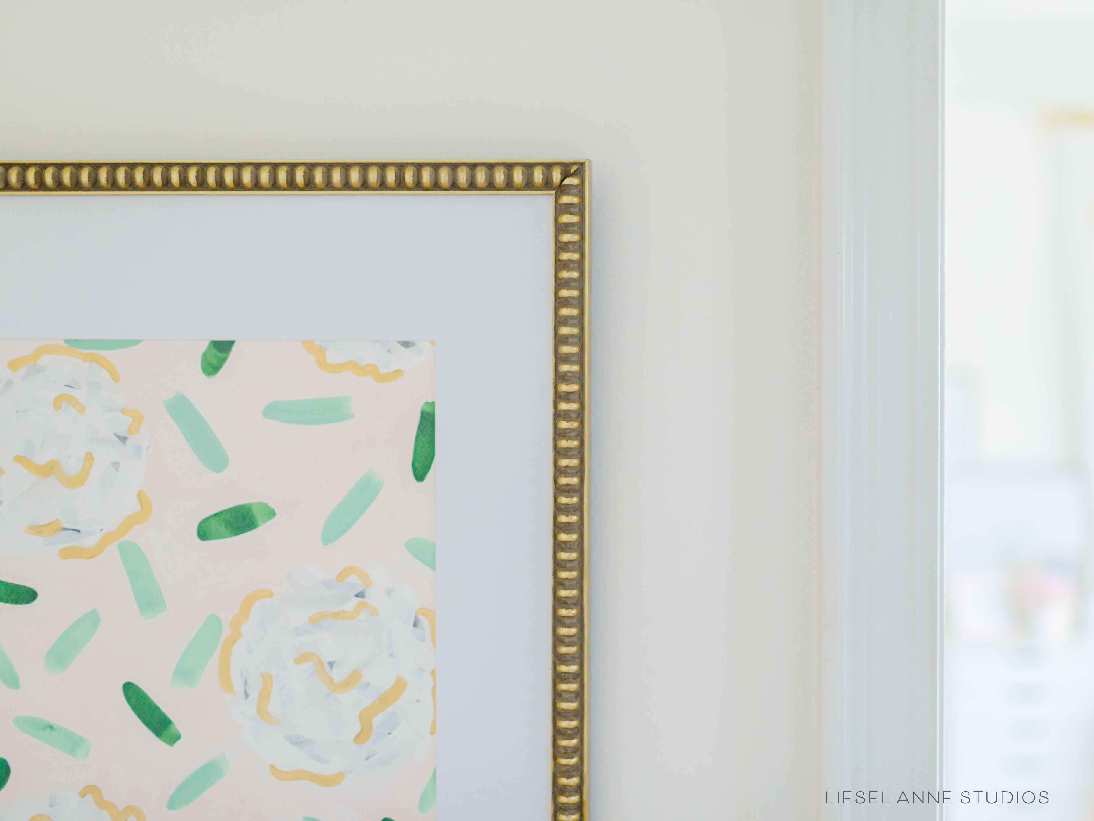 Golden Hydrangea | Blush & White VI-Original artwork measures 11"x14" | Hand-Painted with gouache on cold press watercolor paper | Matted and framed in gold wood frame sized 16"x20" | Glare-resistant glass | Hanging hardware included | Features our signature Golden Hydrangea design with a pale pink base, white hydrangeas and shimmery gold accents | Initialed in gold by the Liesel Anne (the artist) on the front and signed and dated on the back.-The Singing Little Bird