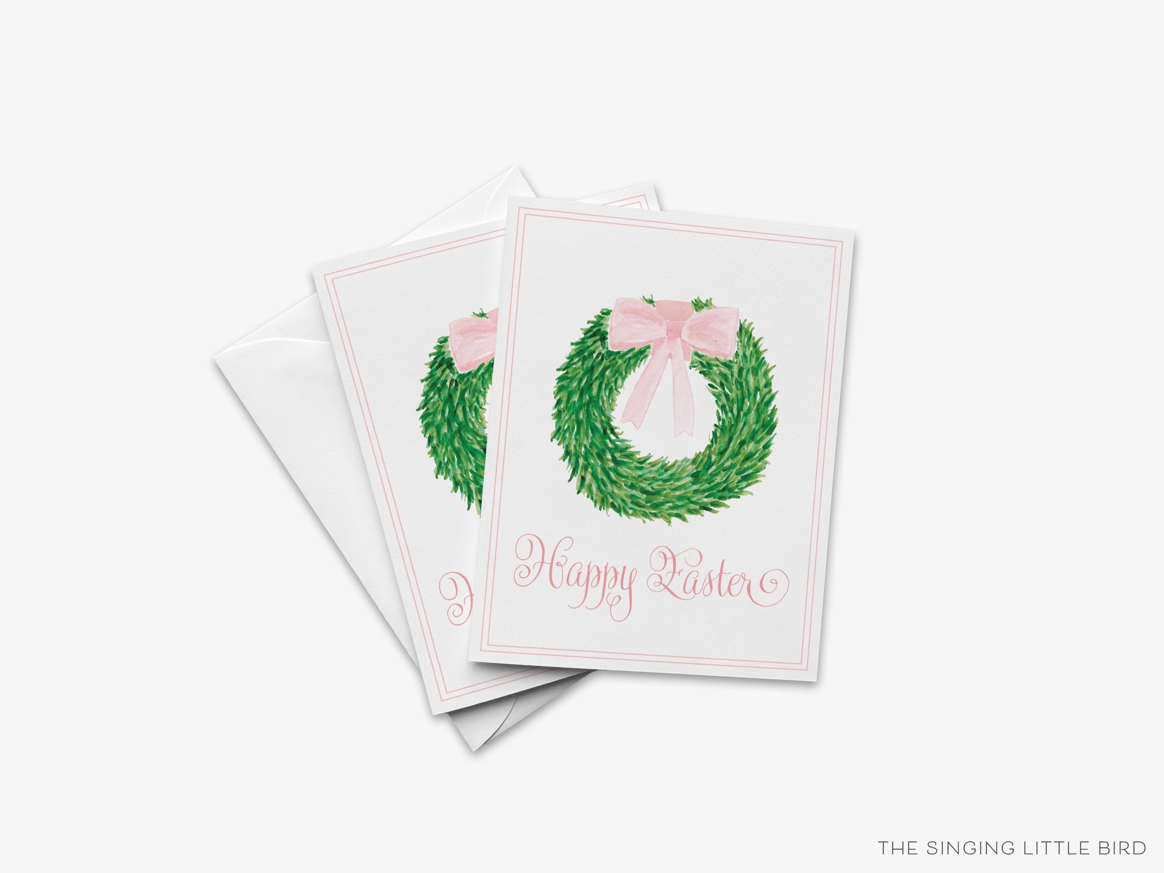 Happy Easter Wreath Greeting Card-These folded spring cards are 4.25x5.5 and feature our hand-painted watercolor wreath with pink bow, printed in the USA on 100lb textured stock. They come with a White envelope and make a thoughtful Easter card for a family member or friend.-The Singing Little Bird