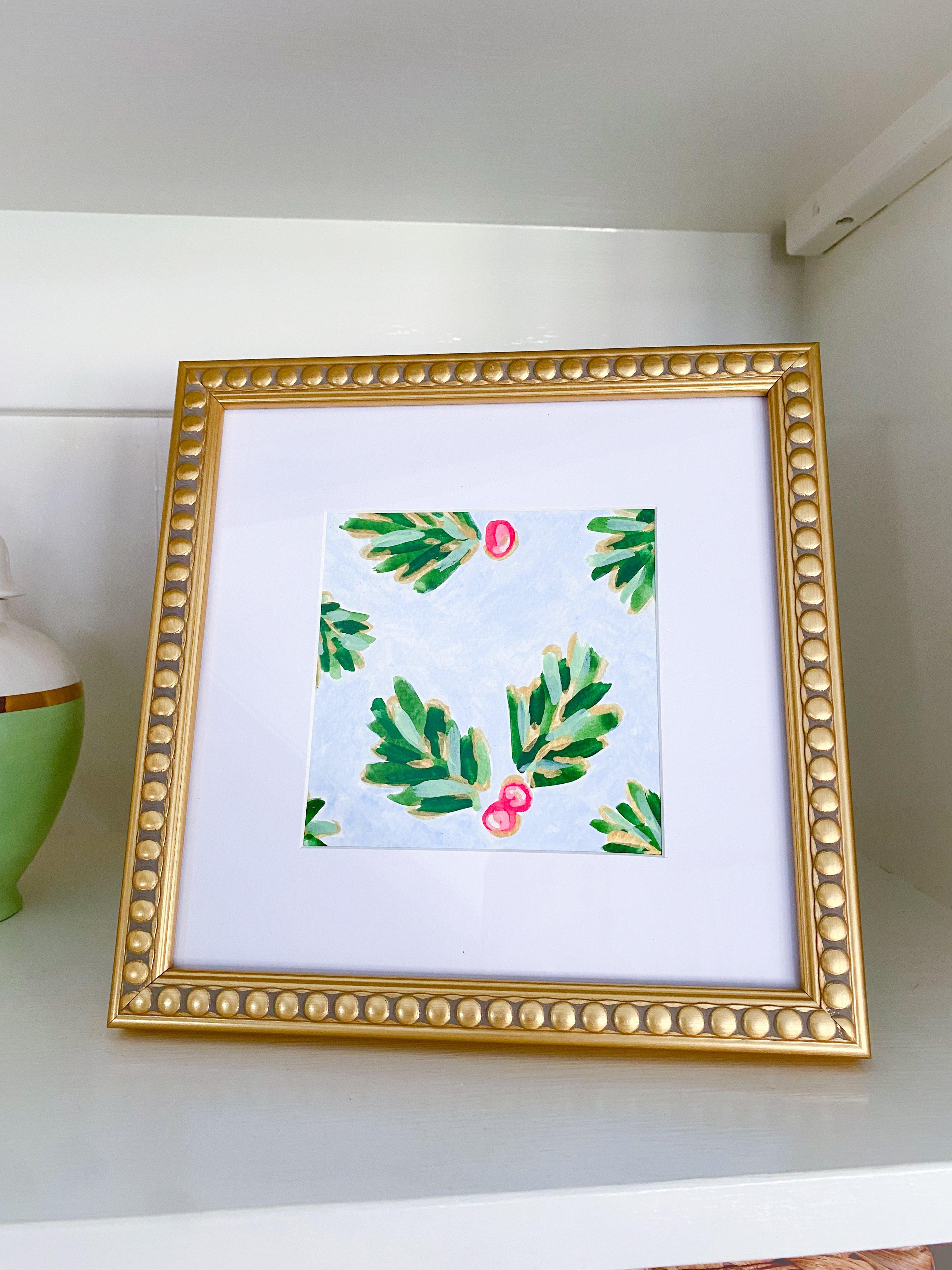 Icy Blue Golden Holly Framed Mini #3-Hand-Painted Framed Mini on cold press watercolor paper (your choice of frame) | Painted with a mixture of gouache and acrylic mediums | Painting Measures 5" x 5" | Magnetic Acrylic block frame: 5" x 5" - stand alone frame great for shelves, bookcases, mantles, dressers and more | Gold Beaded Frame: 8" x 8" matted to 5" x 5" - stand alone frame with the ability to be hung on the wall as well | Features the Golden Holly design with an light blue base and shimmery gold acc