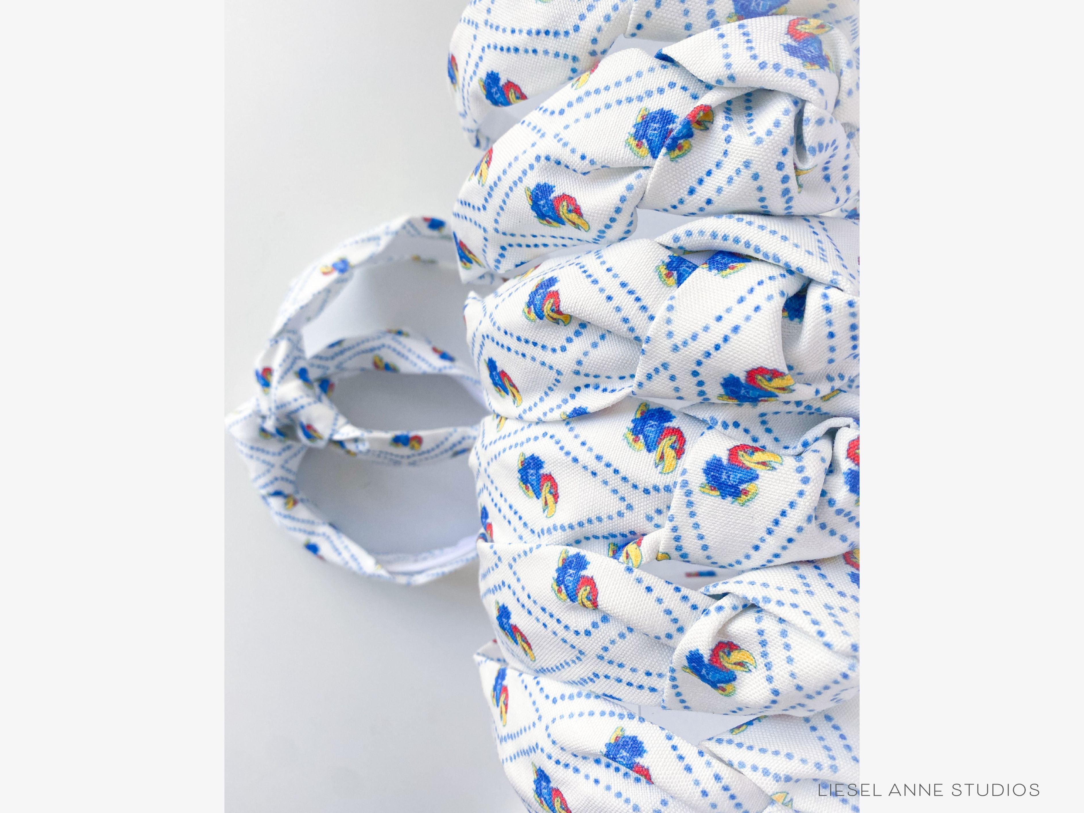 Jayhawk Officially Licensed Blue and White Dotted Diamond Headband-These fabric headbands make unique one-of-a-kind gifts as each one is slightly different. They are cut from our hand-painted signature print. These are the perfect accessory and make great gifts!-The Singing Little Bird