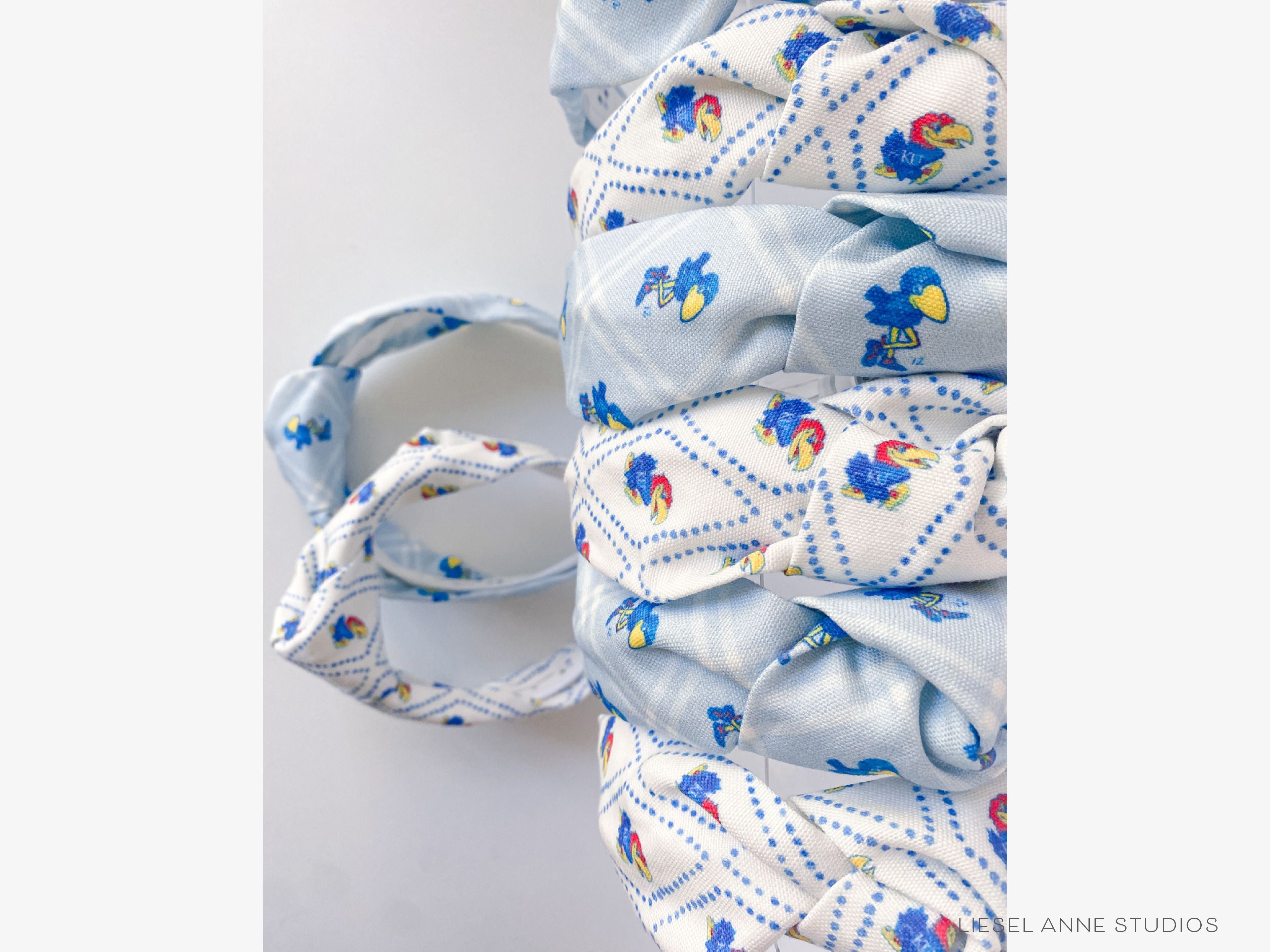 Jayhawk Officially Licensed Blue and White Dotted Diamond Headband-These fabric headbands make unique one-of-a-kind gifts as each one is slightly different. They are cut from our hand-painted signature print. These are the perfect accessory and make great gifts!-The Singing Little Bird