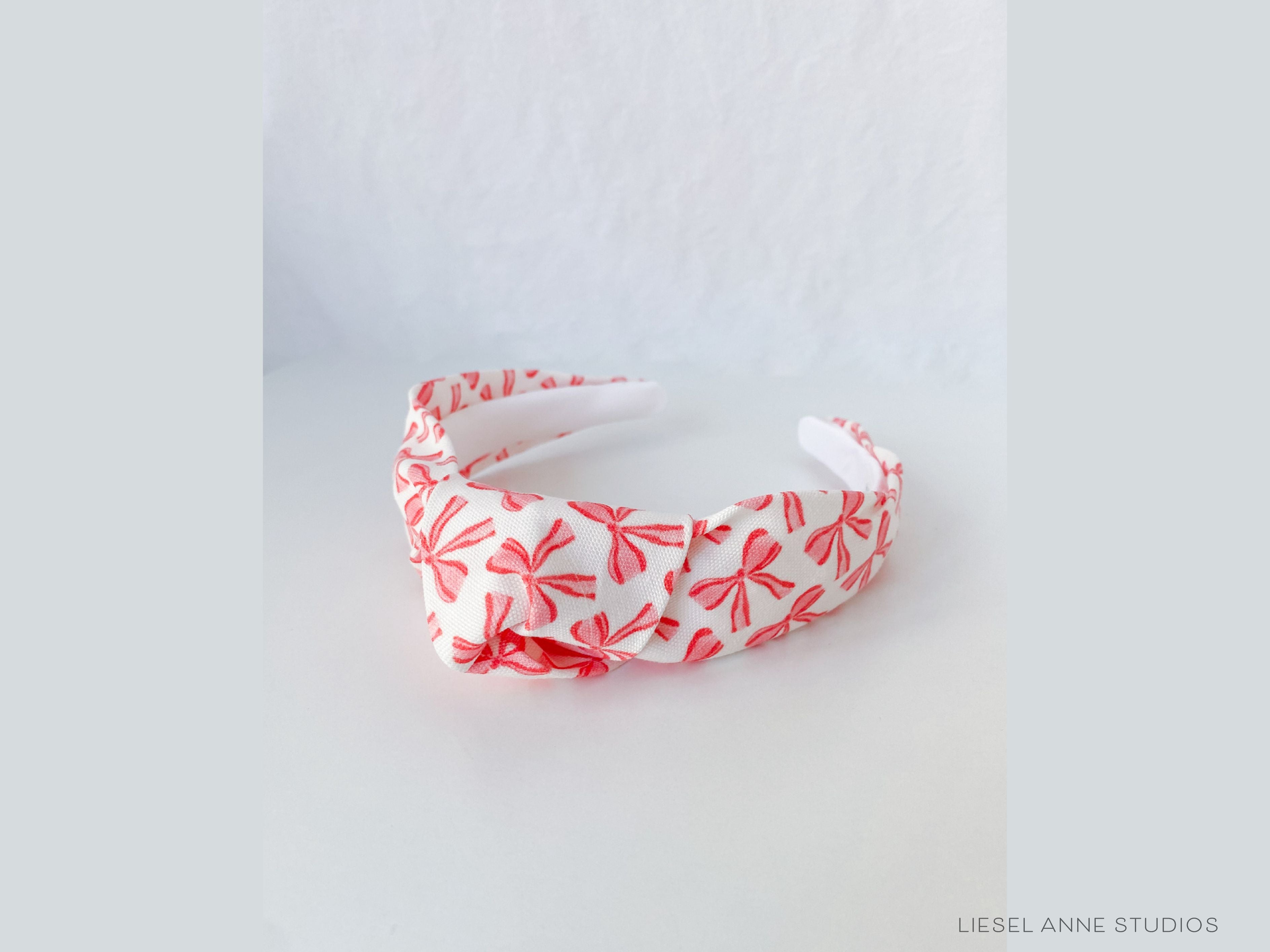 Red Bow Top Knot Headband-These fabric headbands make unique one-of-a-kind gifts as each one is slightly different. They are cut from our hand-painted signature print. These are the perfect accessory and make great gifts!-The Singing Little Bird