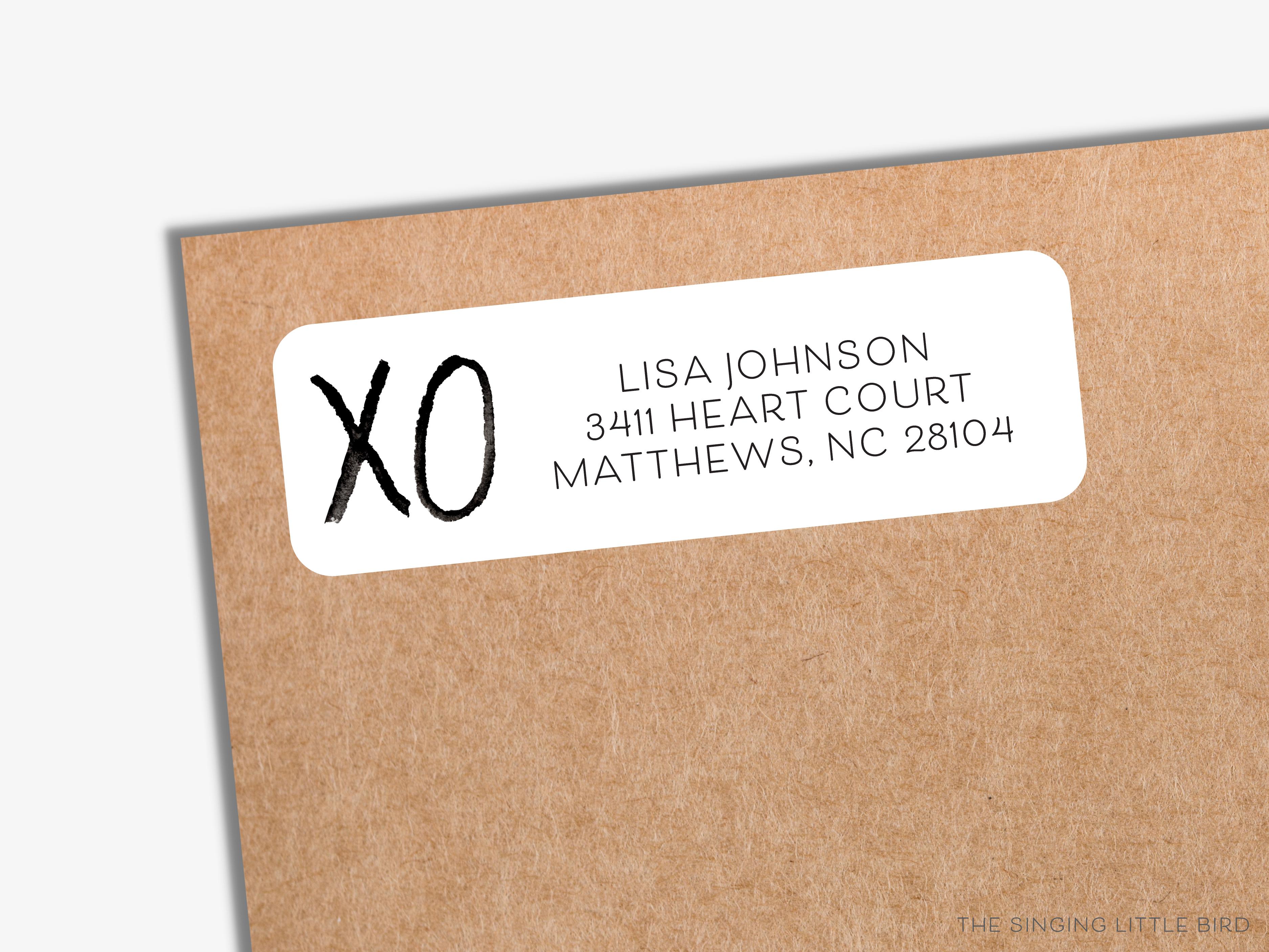 XO Black and White Return Address Labels-These personalized return address labels are 2.625" x 1" and feature our hand-painted watercolor XO, printed in the USA on beautiful matte finish labels. These make great gifts for yourself or the hugs and kisses lover.-The Singing Little Bird