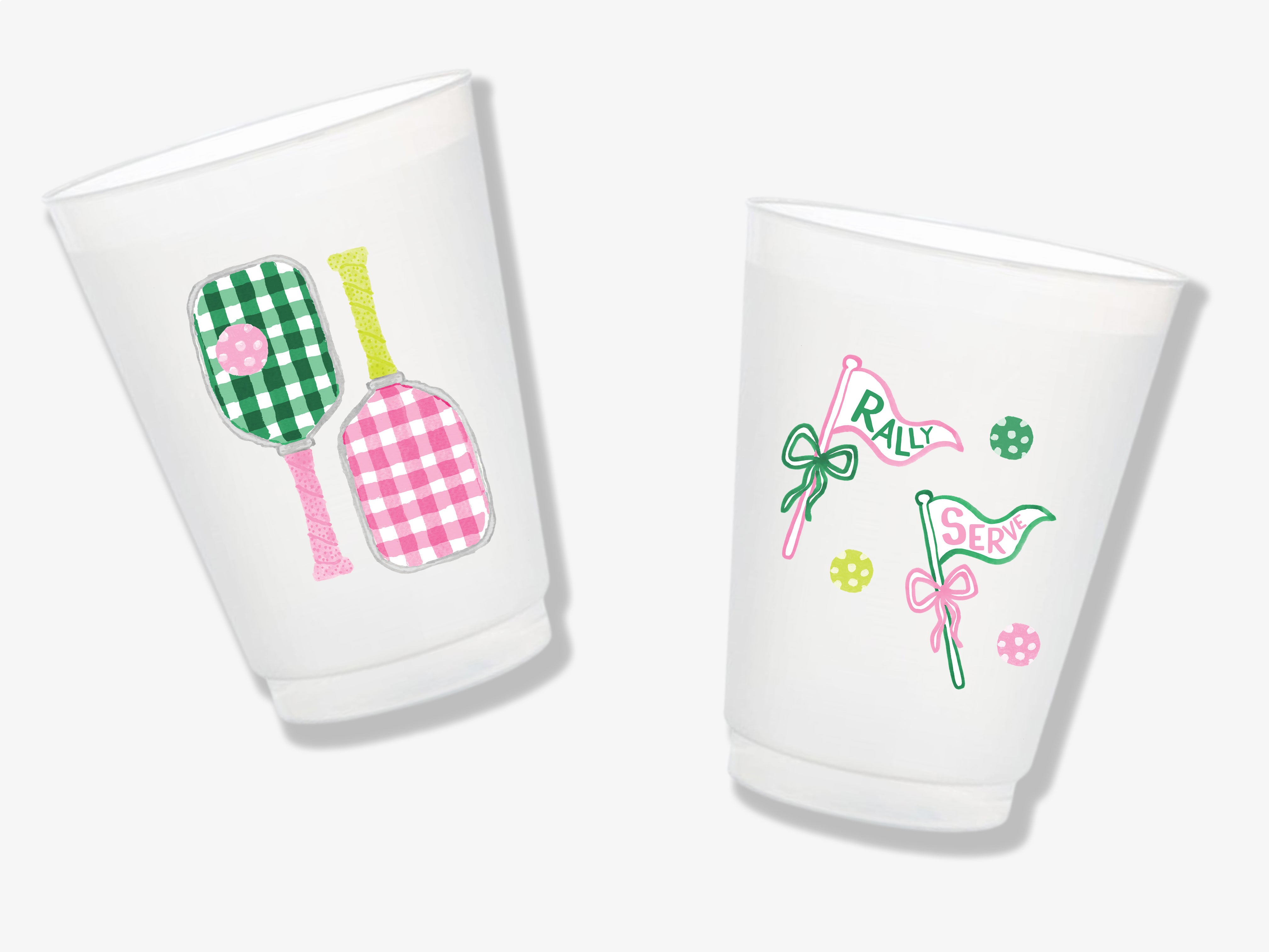 Two white plastic cups with colorful designs on them.