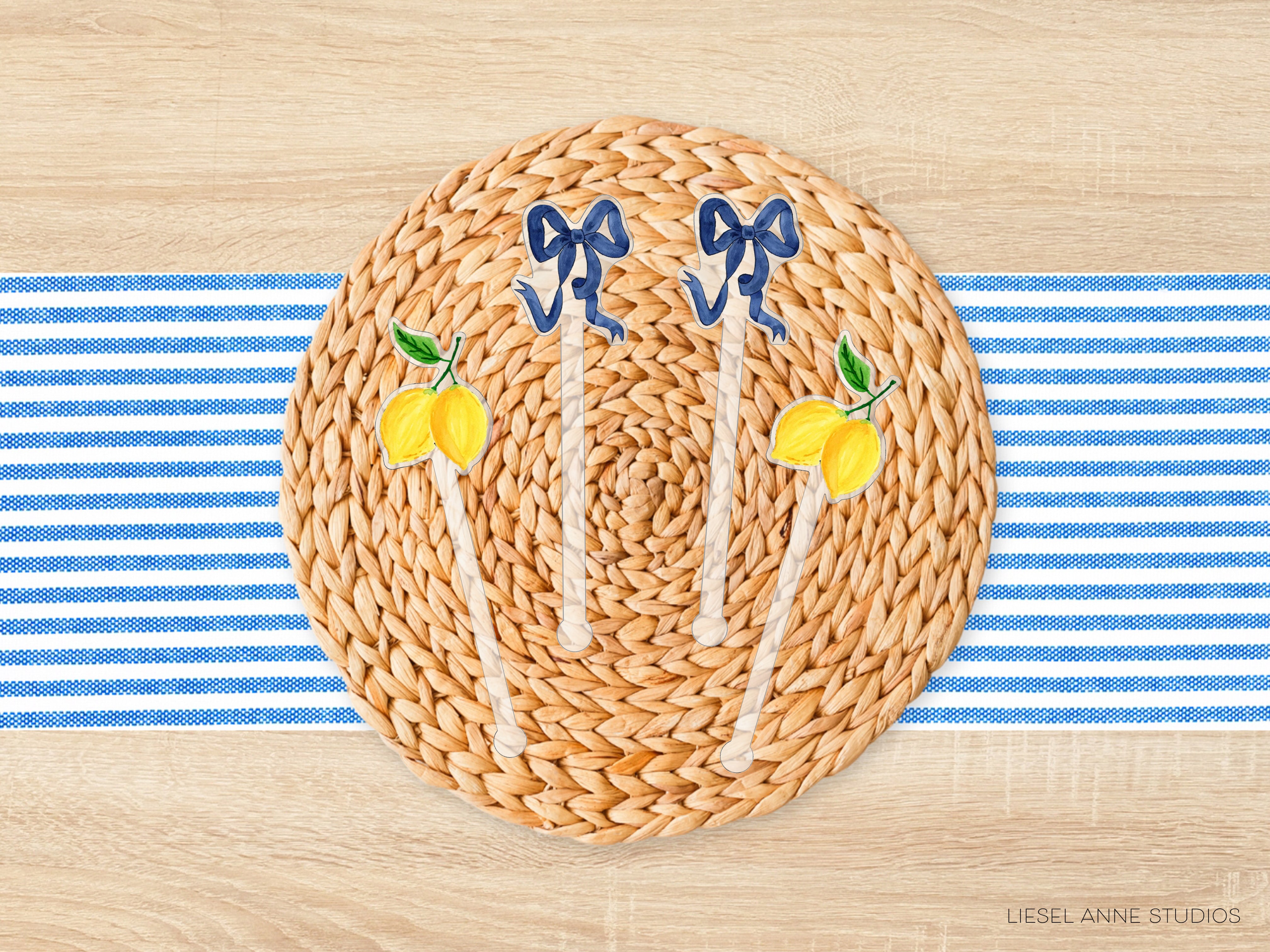 A woven placemat with a blue ribbon and lemons on it, placed on a wooden surface with blue and white striped fabric.