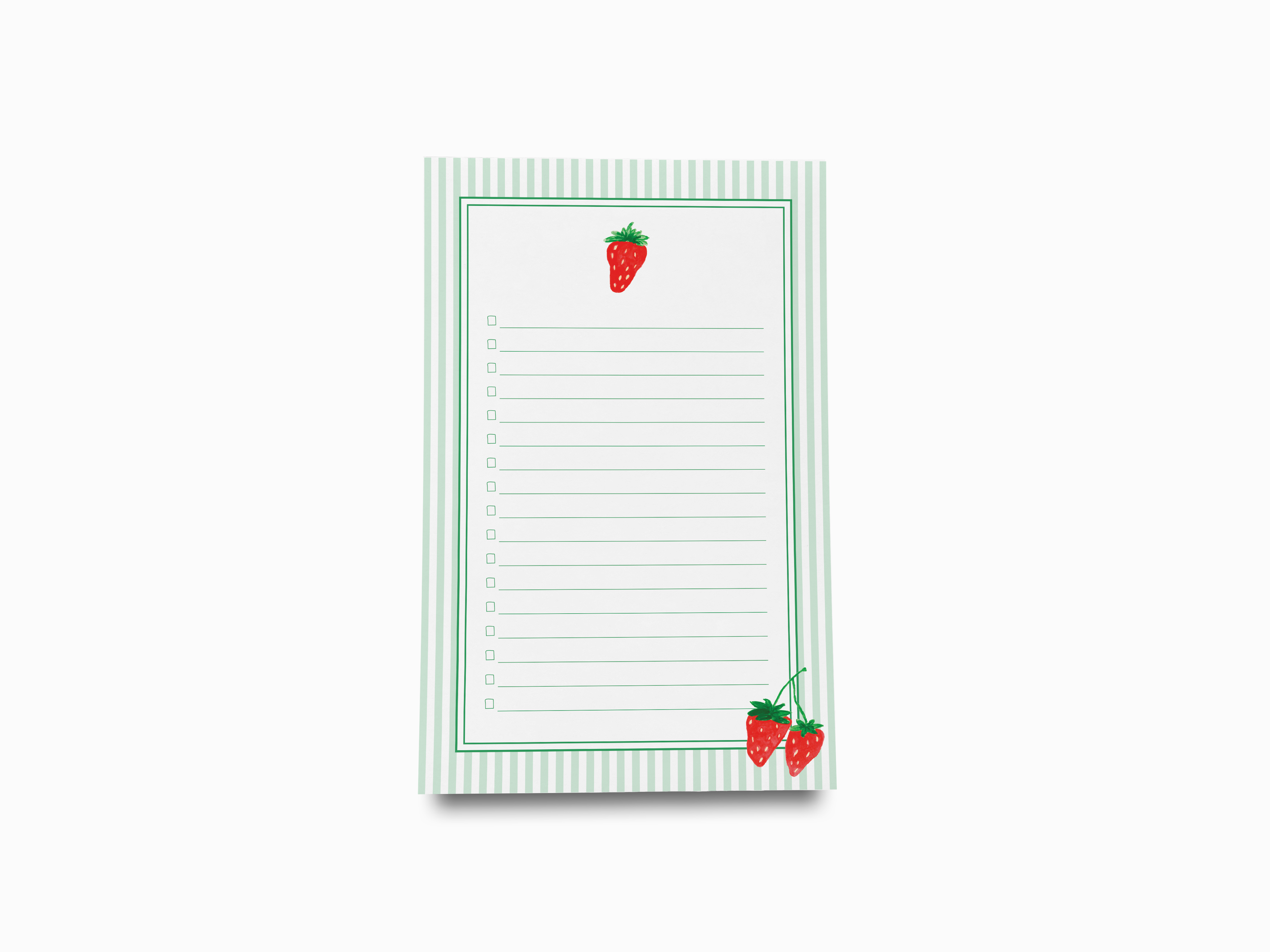 a notepad with a strawberry on it