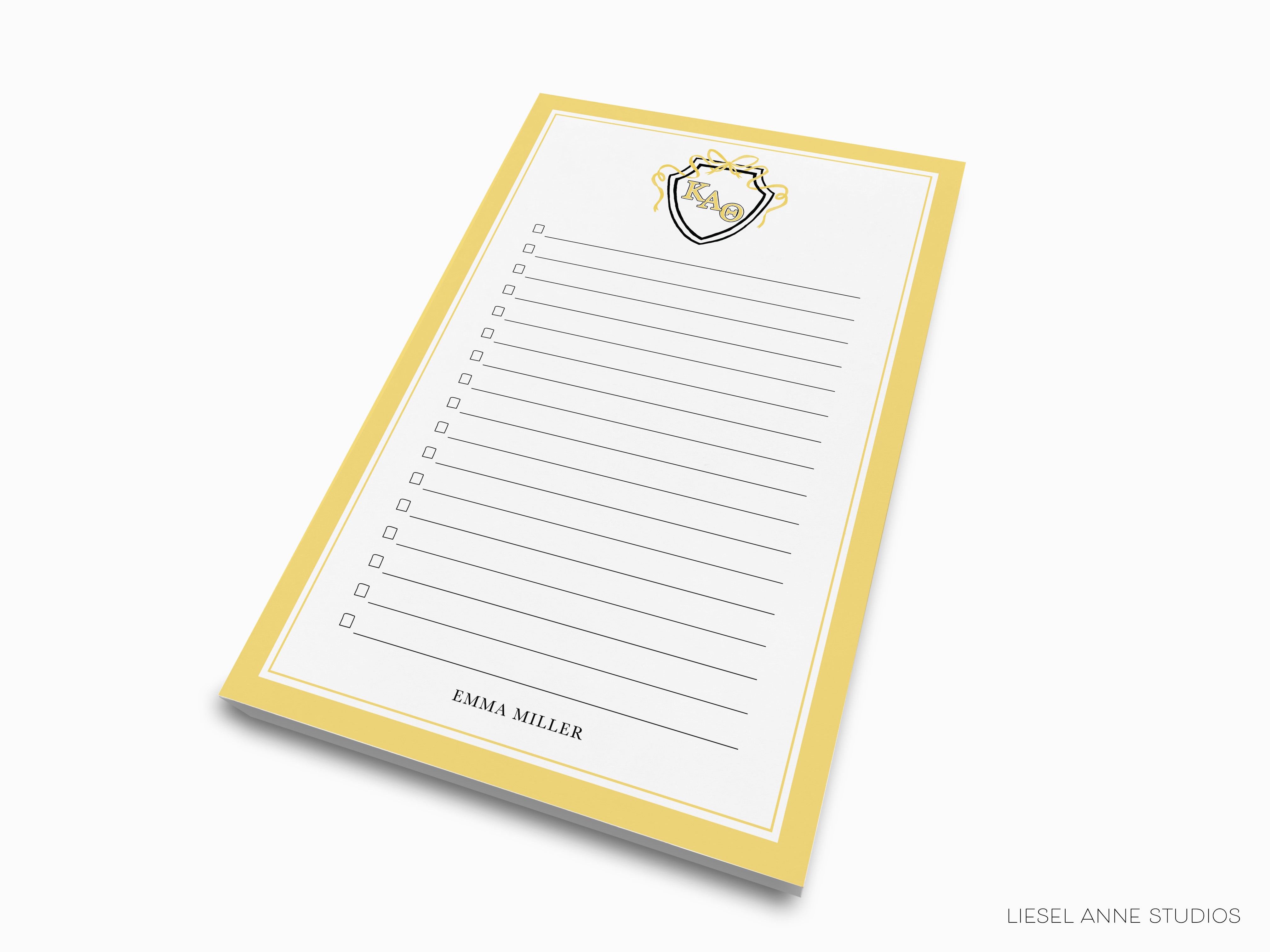 a yellow and white notepad with a picture of a heart on it