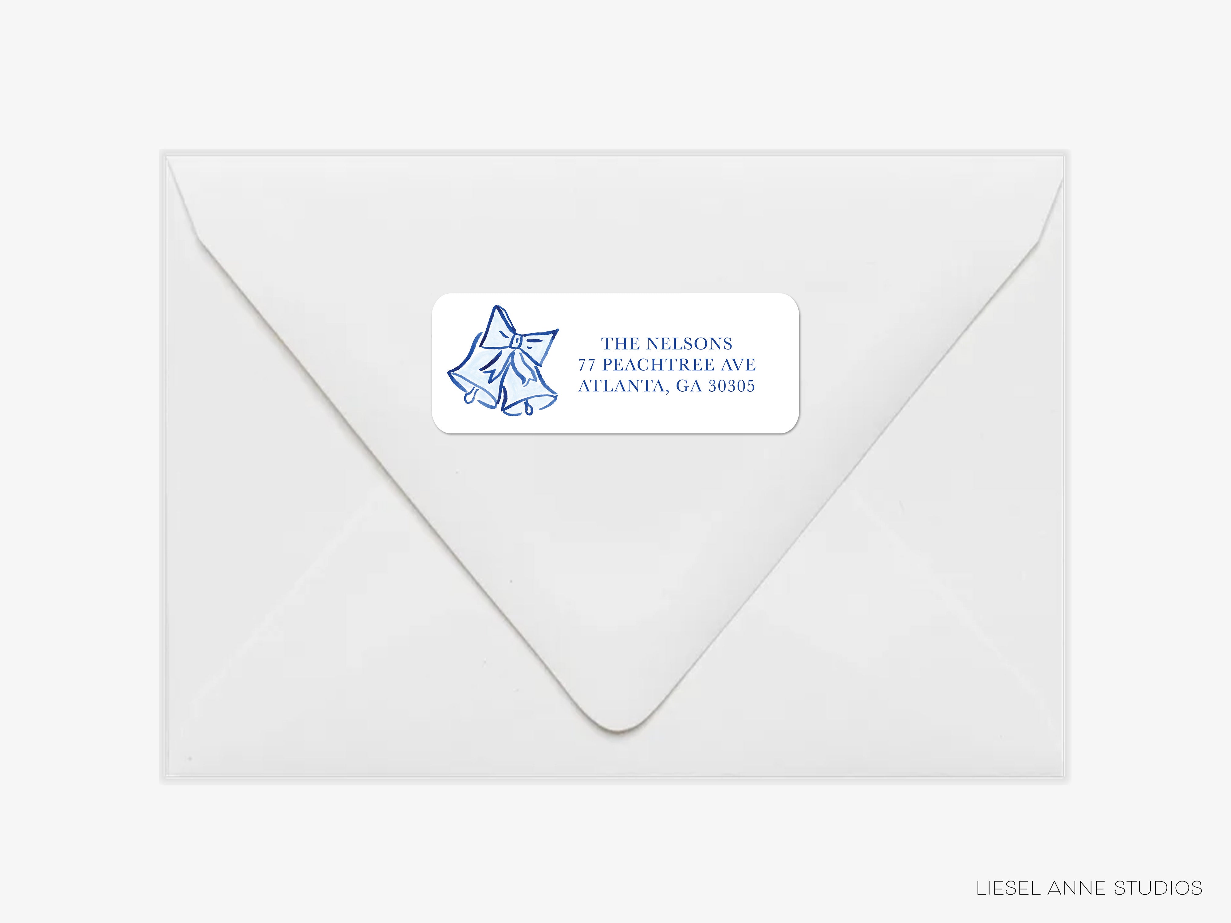 a white envelope with a blue label on it, which contains the address of a residence.