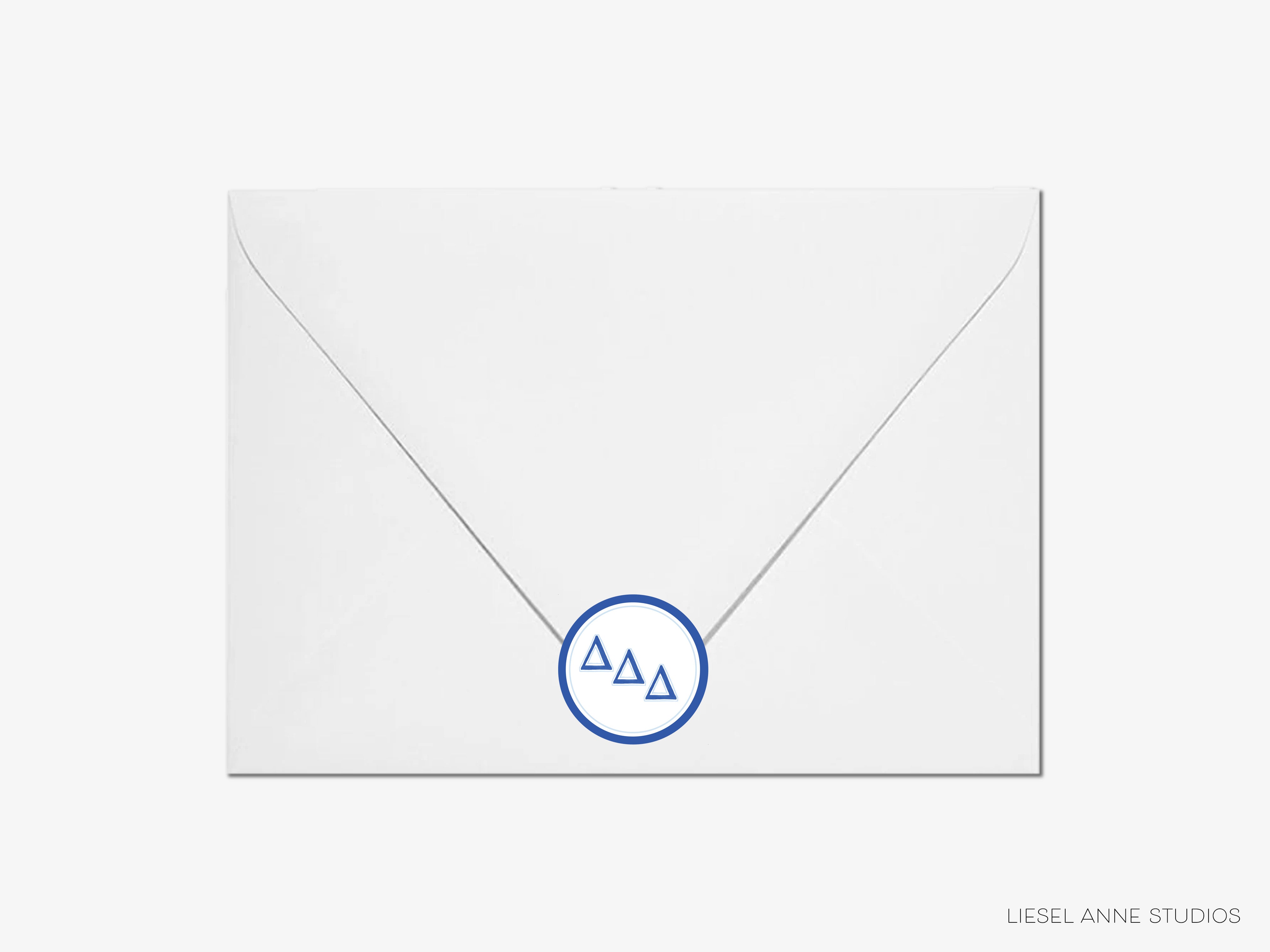 a white envelope with a blue monogrammed logo