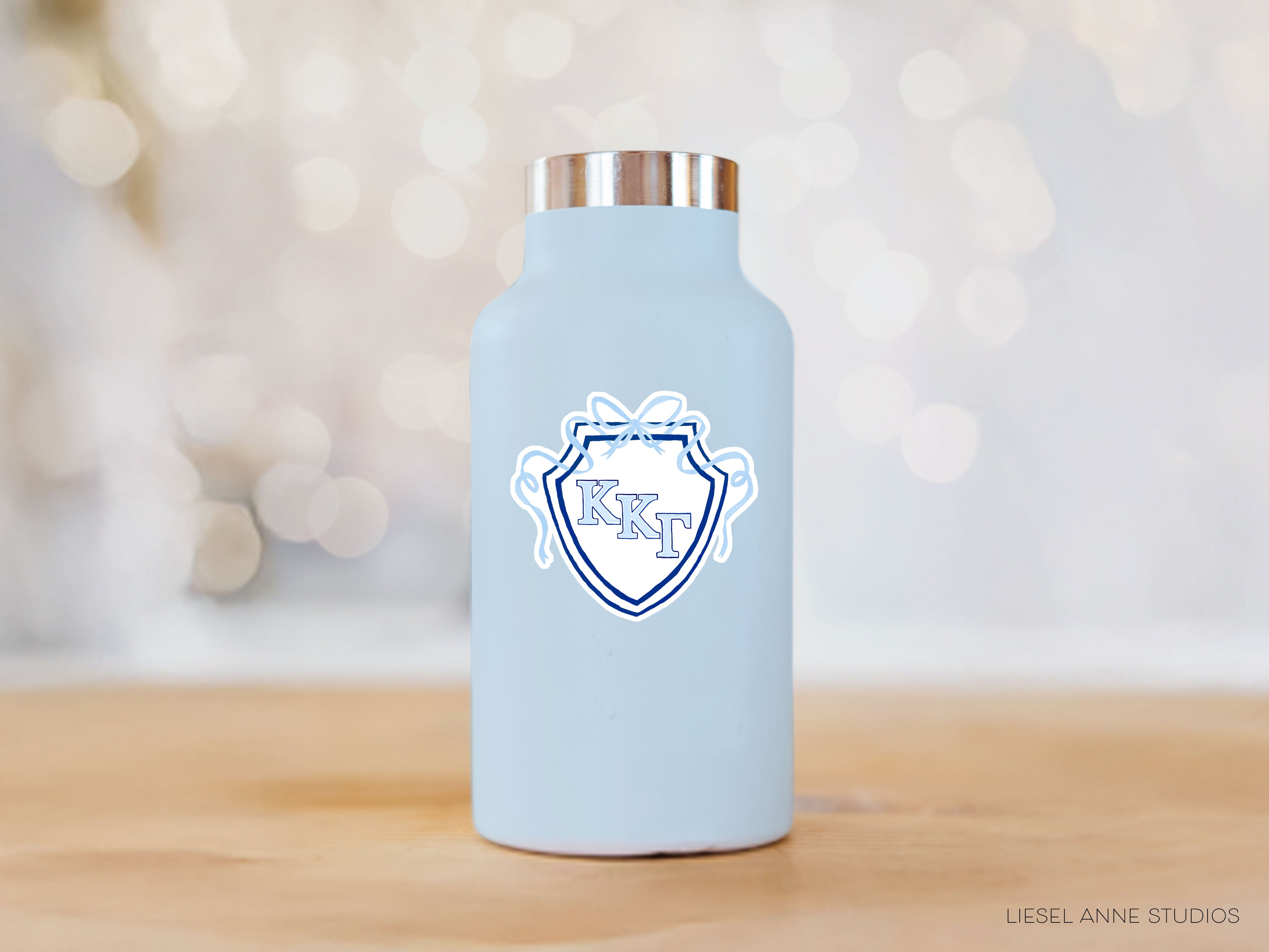a blue water bottle sitting on top of a wooden table