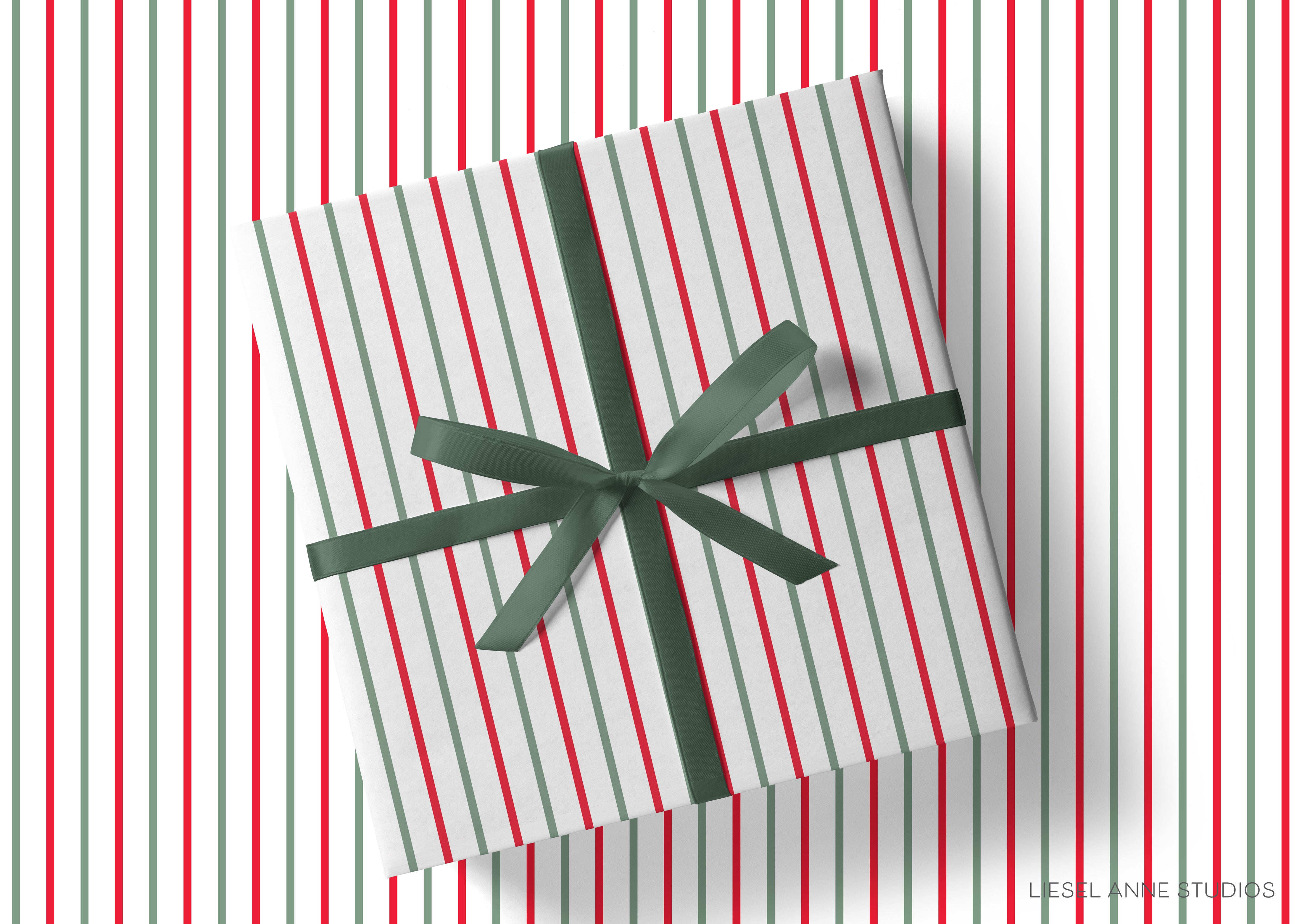 A gift box wrapped in a striped paper with a green ribbon tied around it, placed on a striped background.