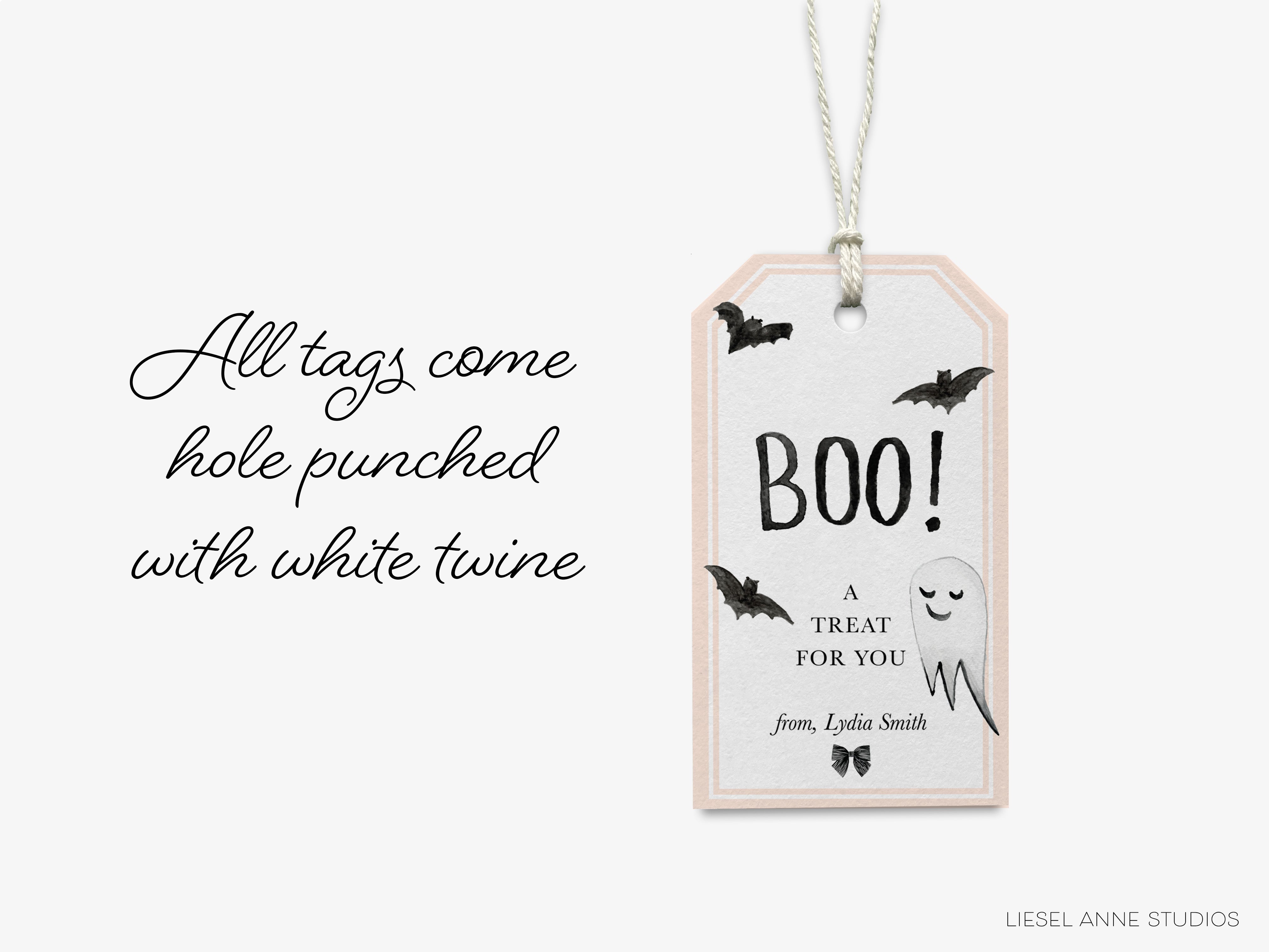 a Halloween-themed tag with the text "All tags come hole punched with white twine" and a ghost decoration.