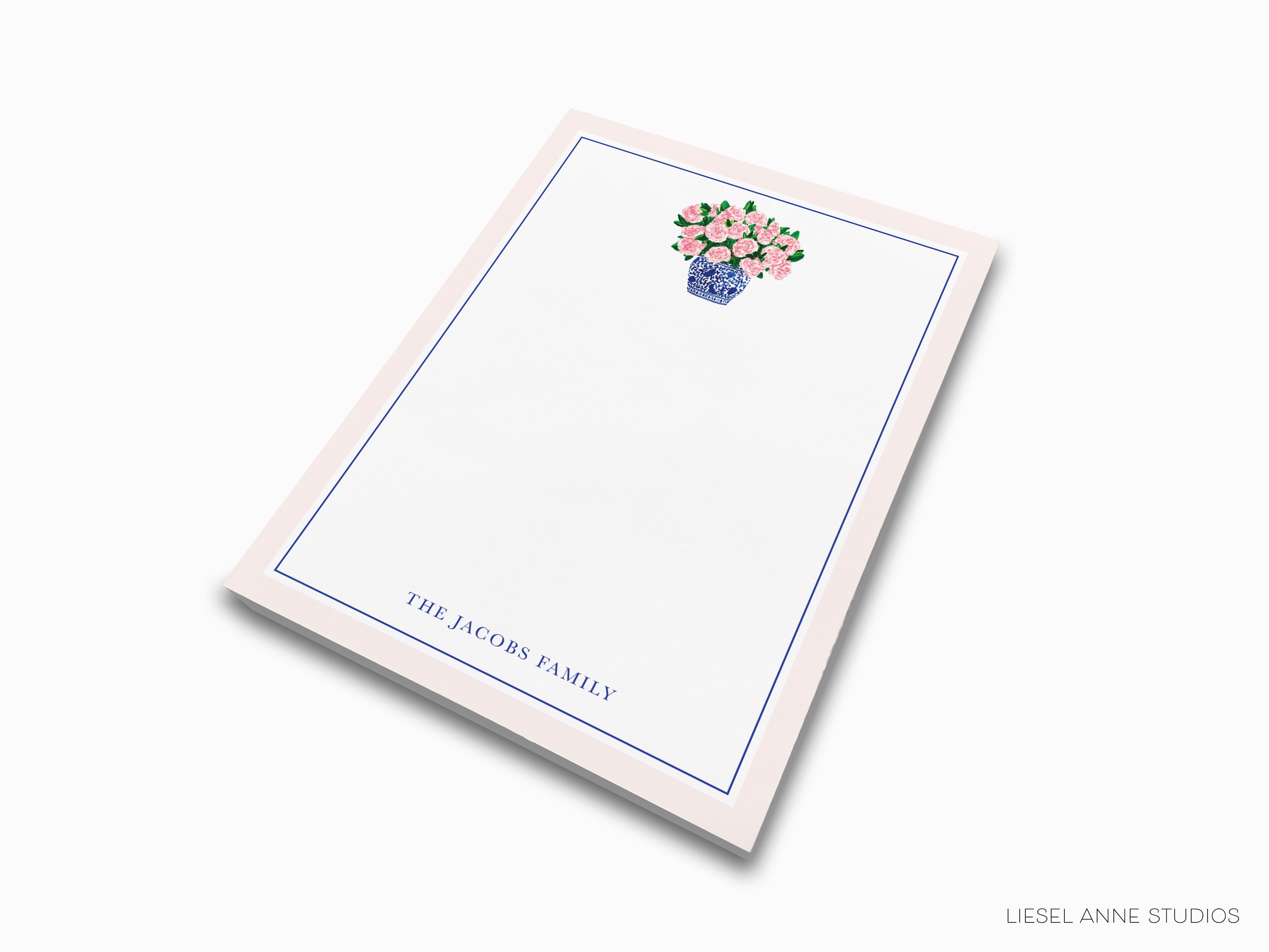 a notepad with a bouquet of flowers on it