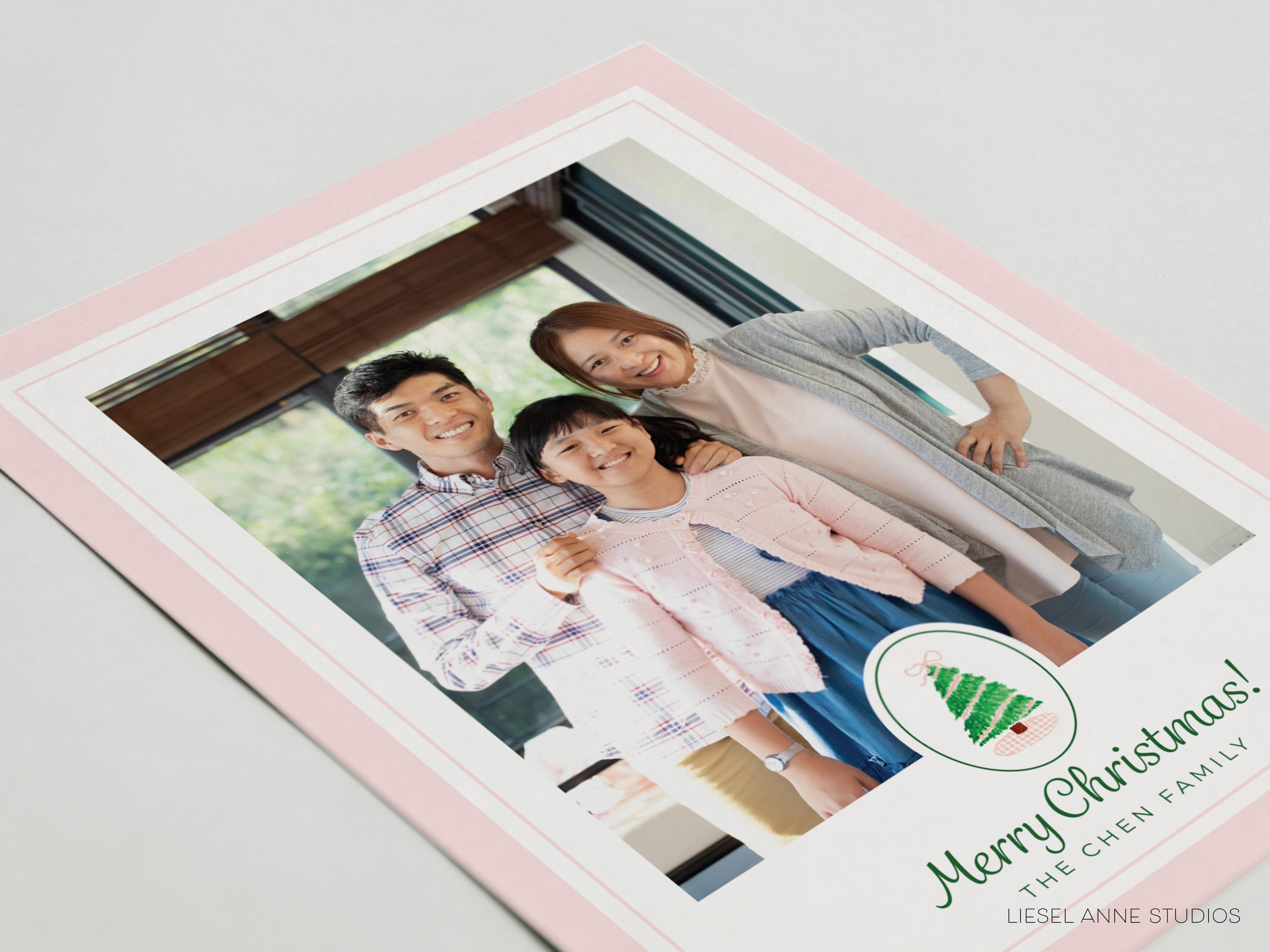 A family portrait of a man, a woman, and a child, smiling together in a warm and joyful moment.