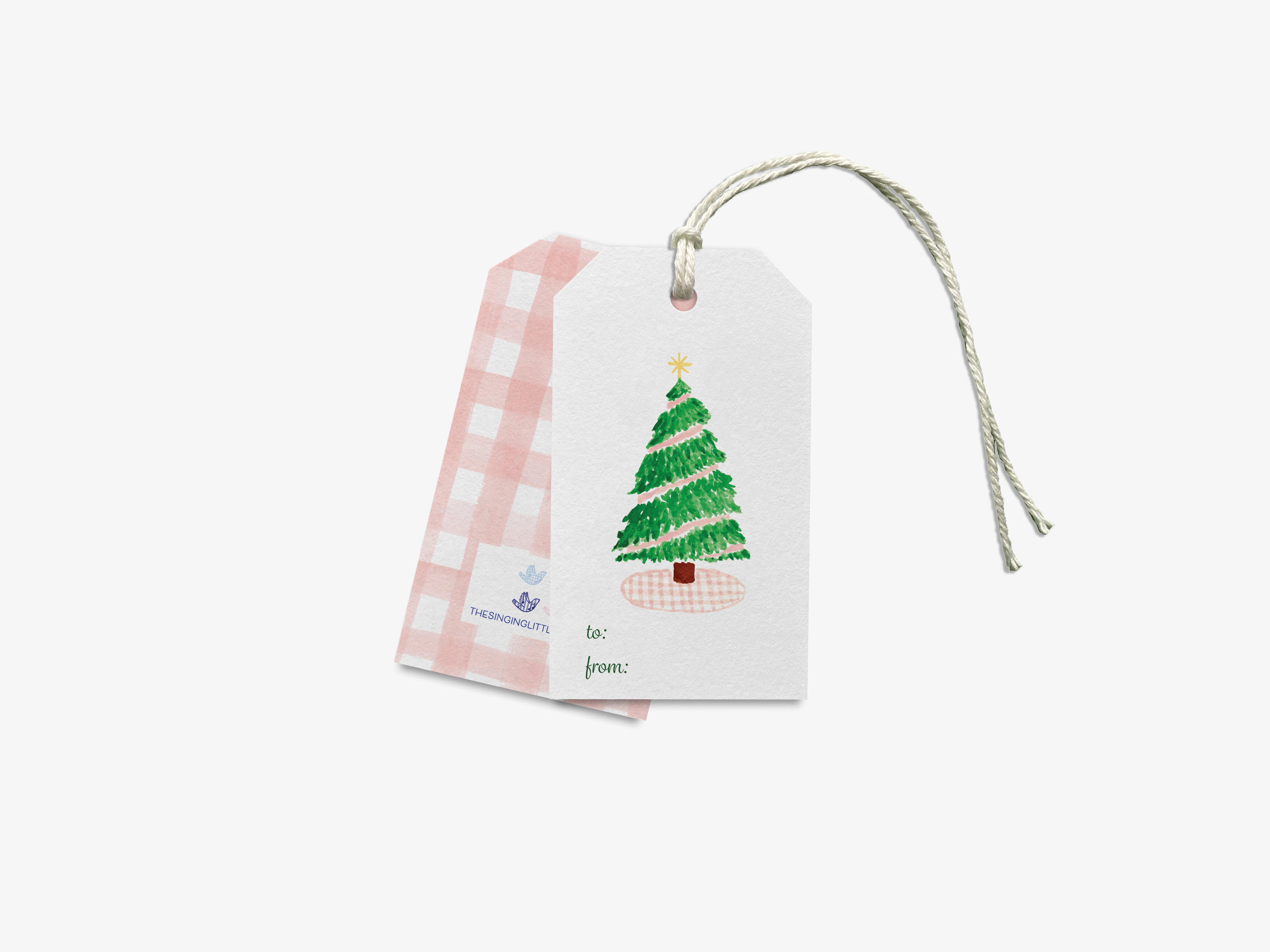 a white Christmas tree gift tag with a pink and white checkered pattern.