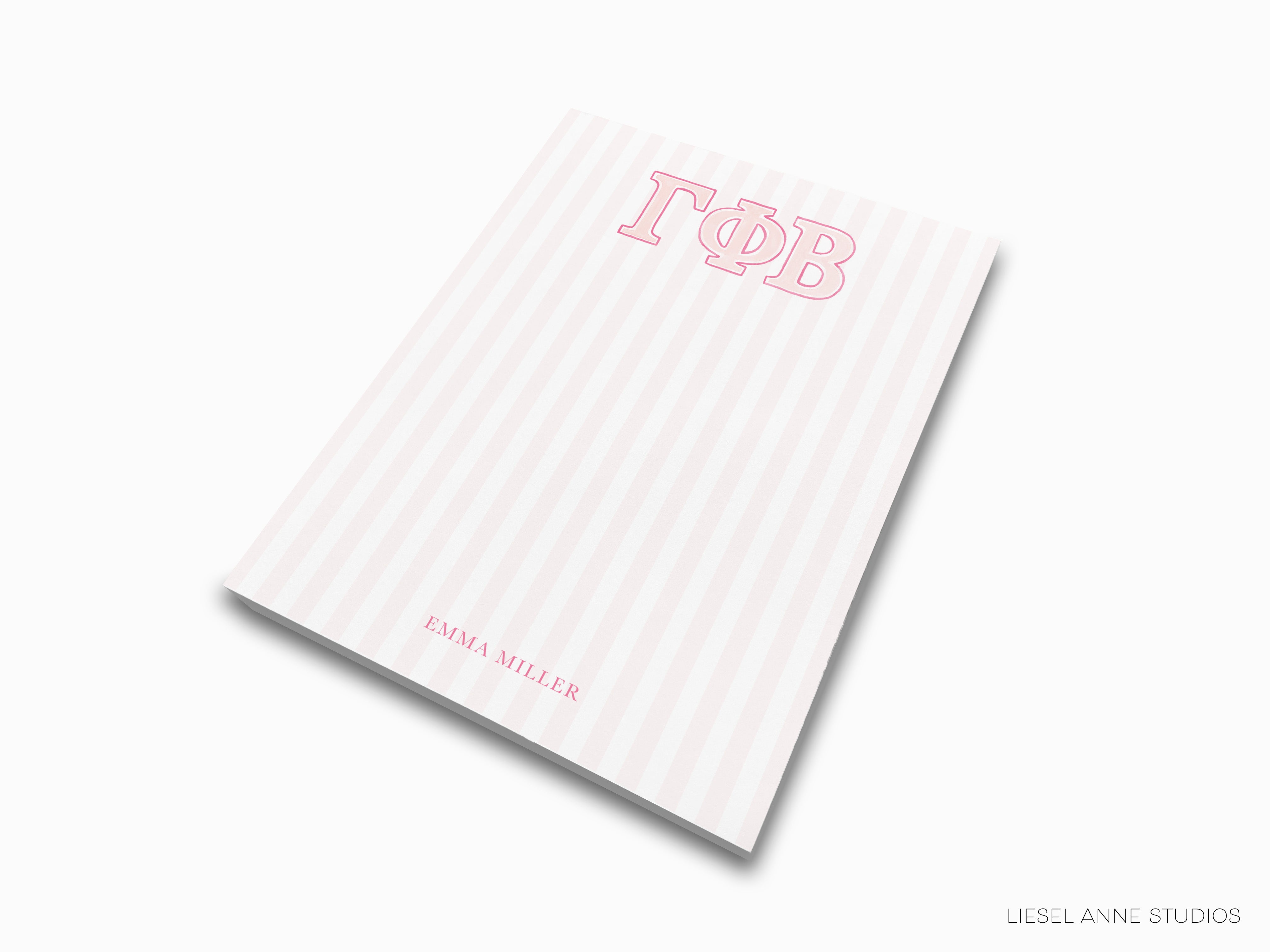 a pink and white striped notebook with the word bob on it