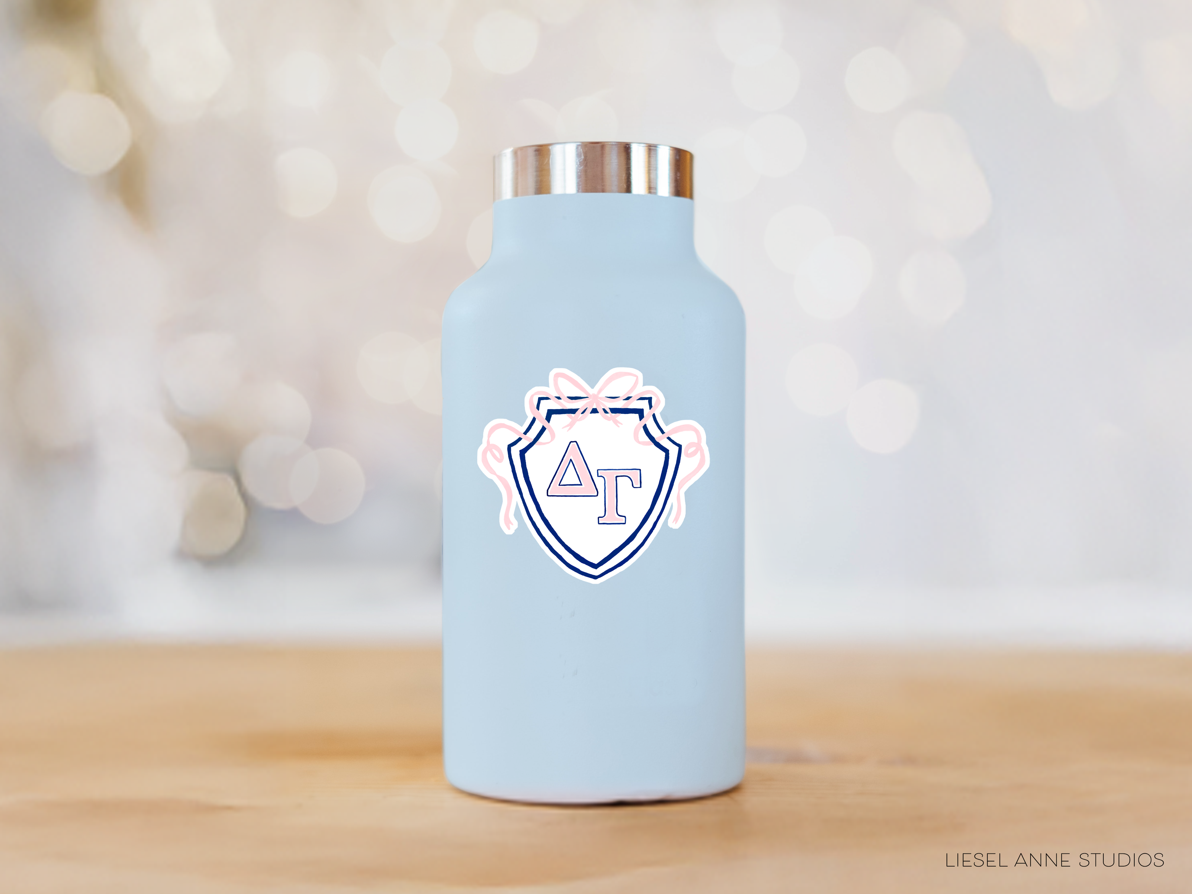 a blue water bottle sitting on top of a wooden table