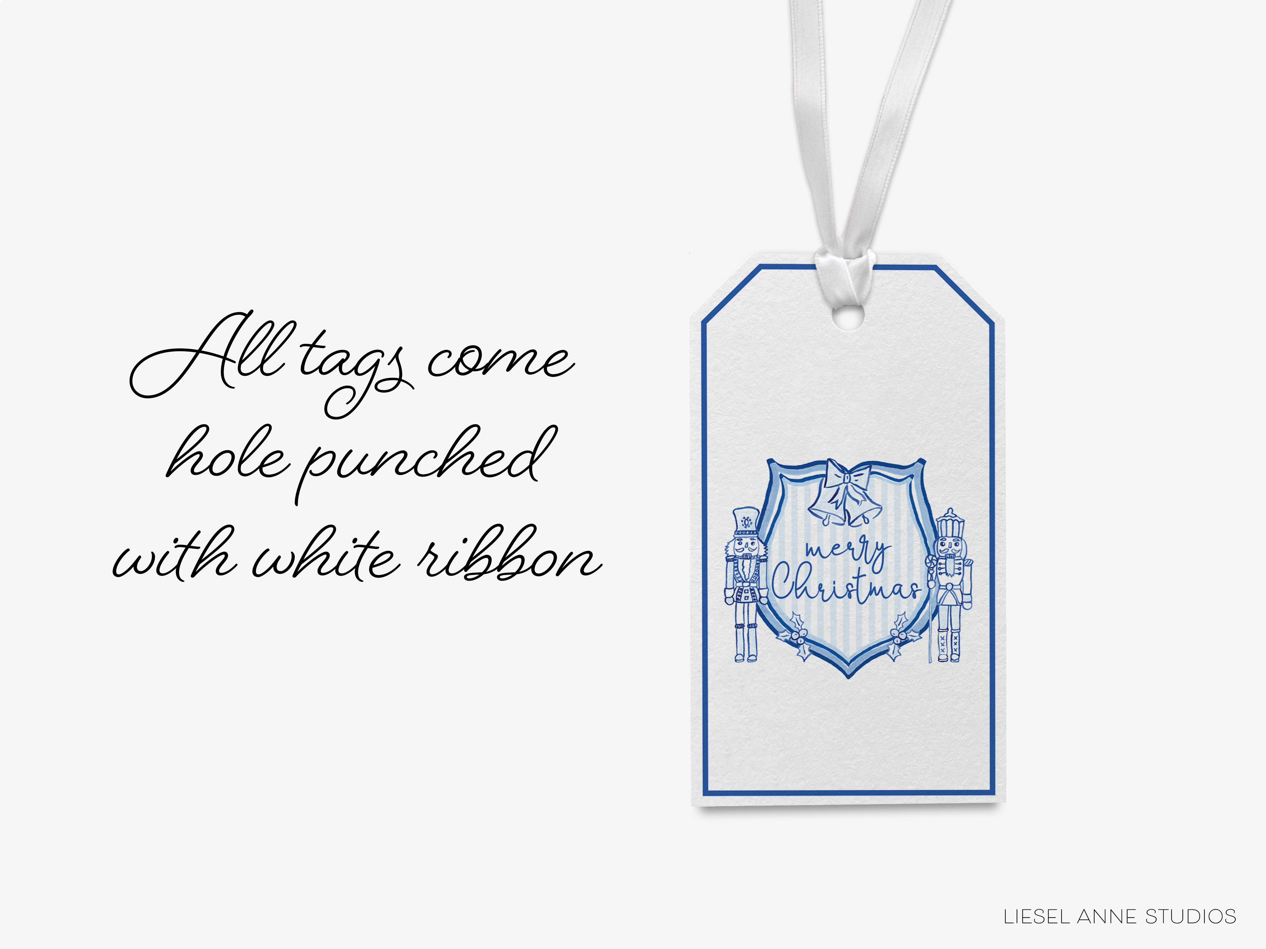 A white ribbon tag with a blue design and text, hanging against a white background.