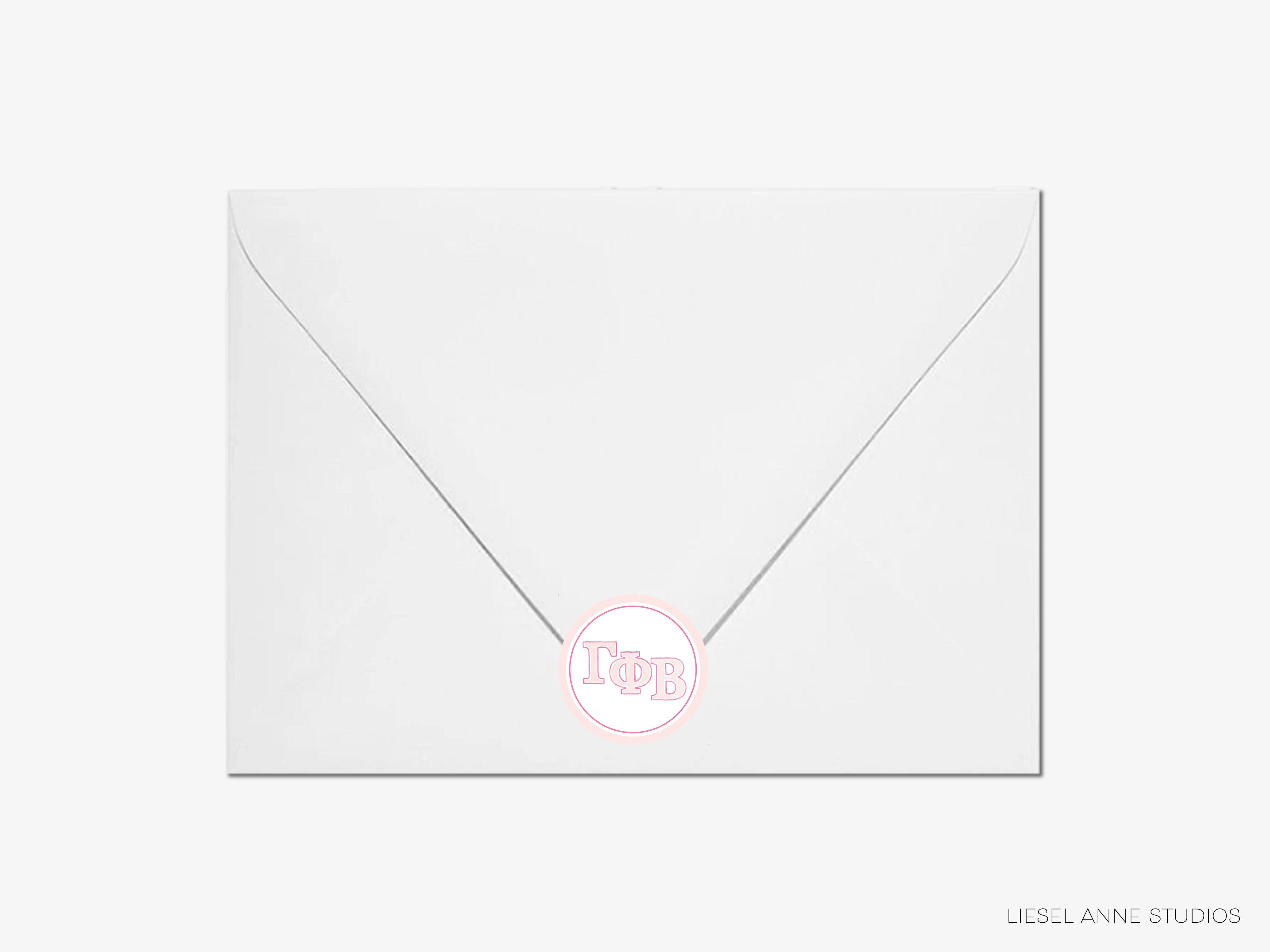 a white envelope with a pink sticker on it
