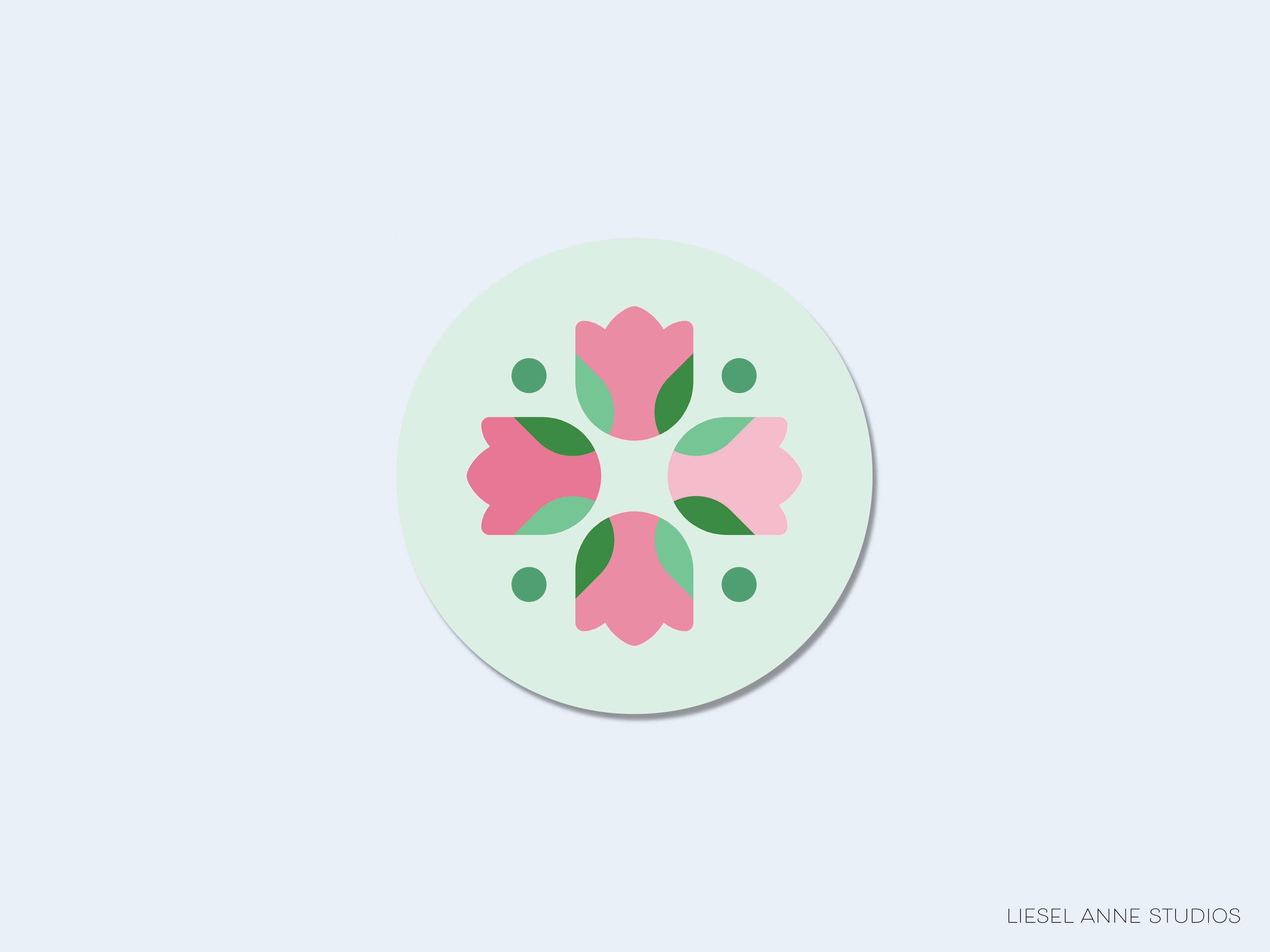 A circular logo featuring a stylized floral design with pink flowers and green leaves.