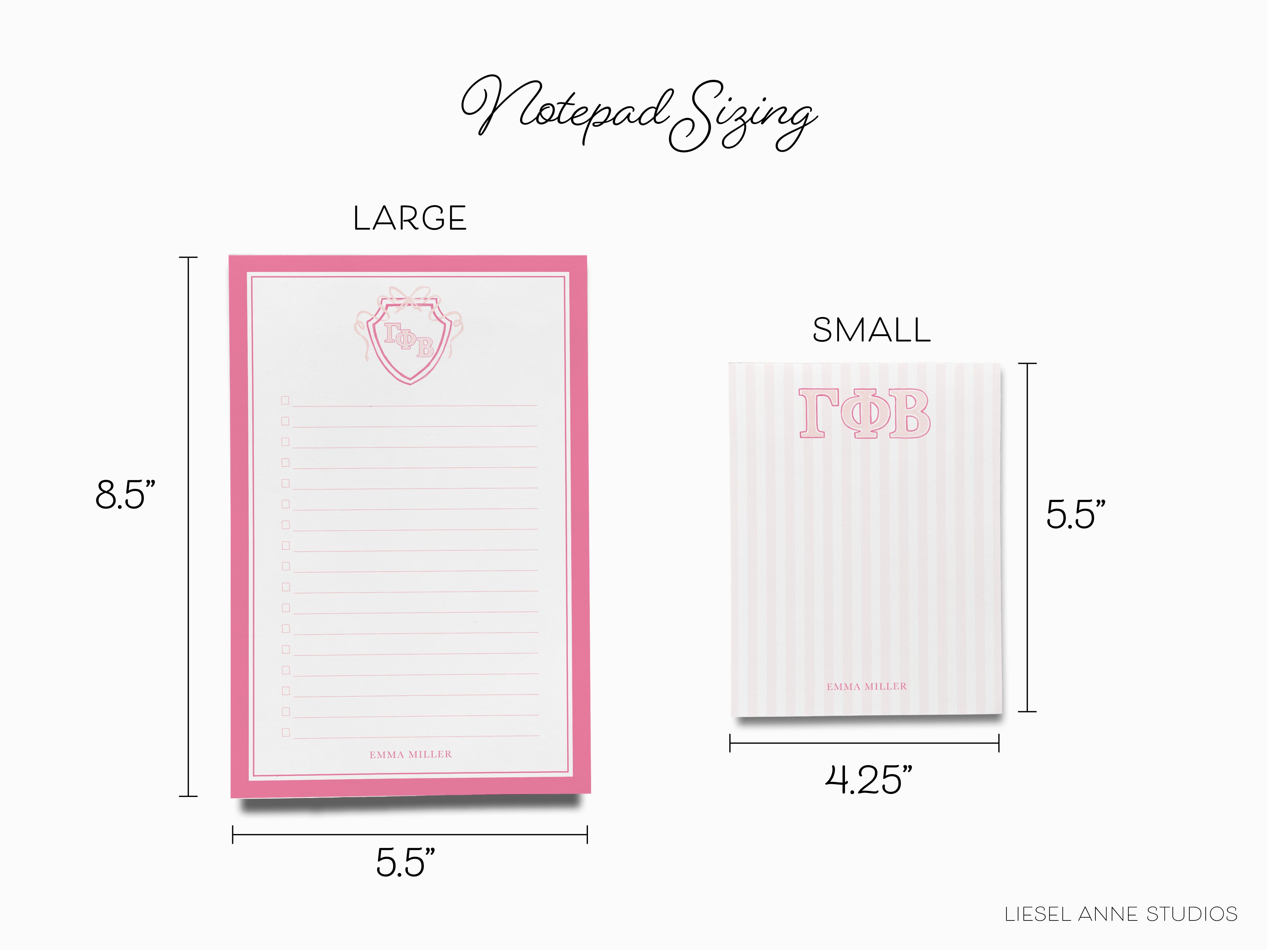 a pink and white notepad with a pink heart on it