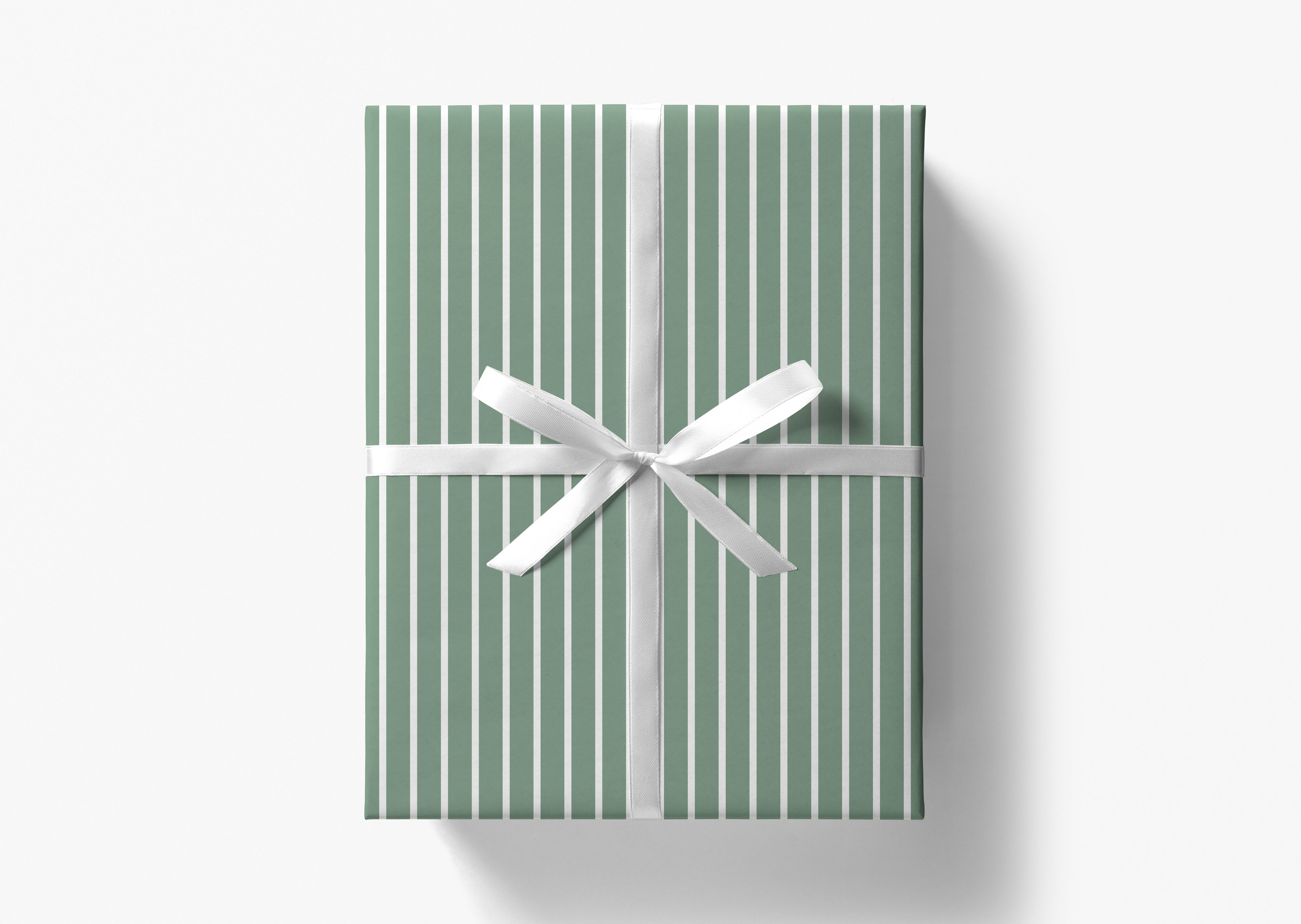 A green gift box with a white ribbon tied around it, presented against a white background.