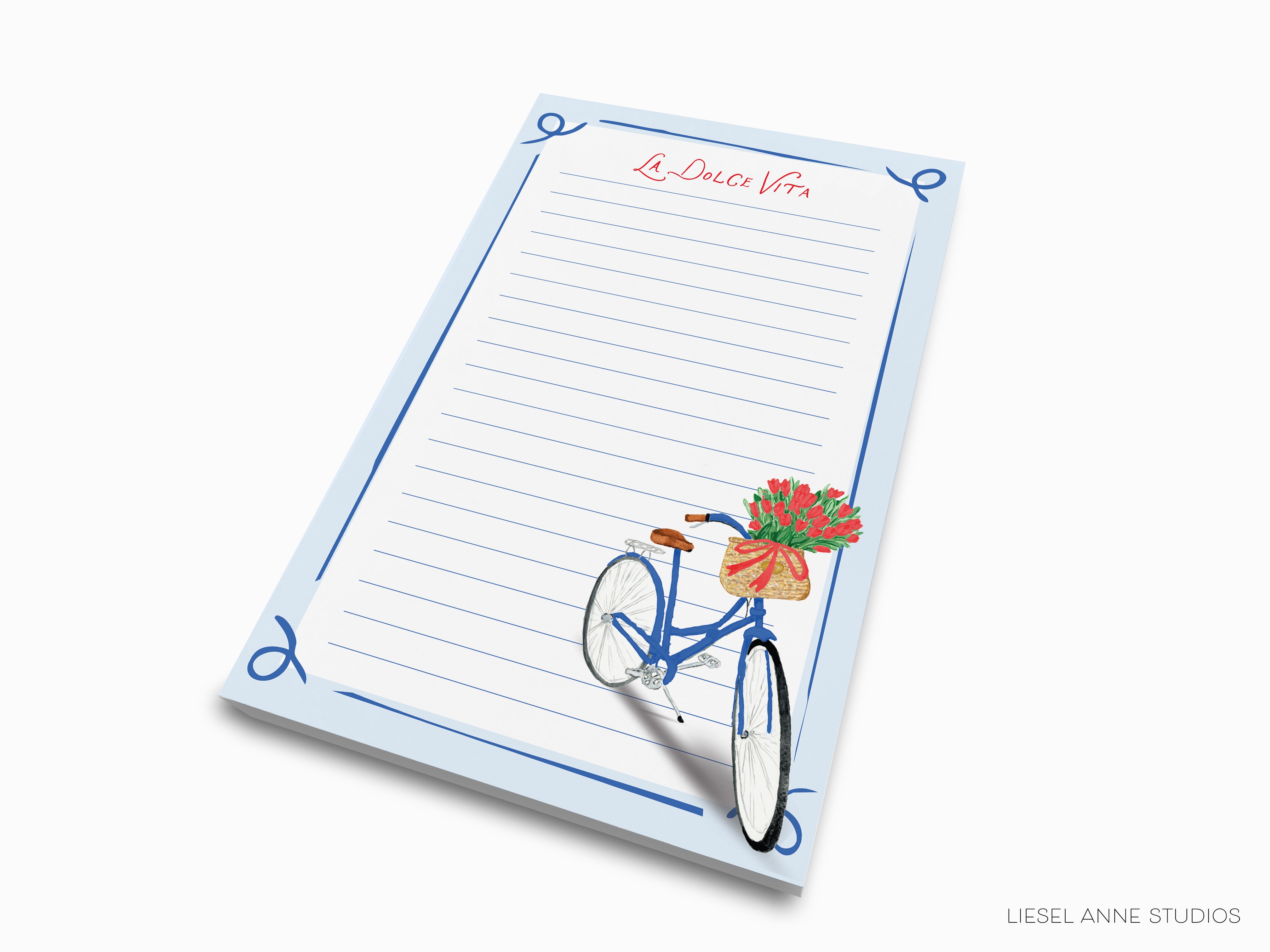 A blue lined notepad with a bicycle illustration on the cover.