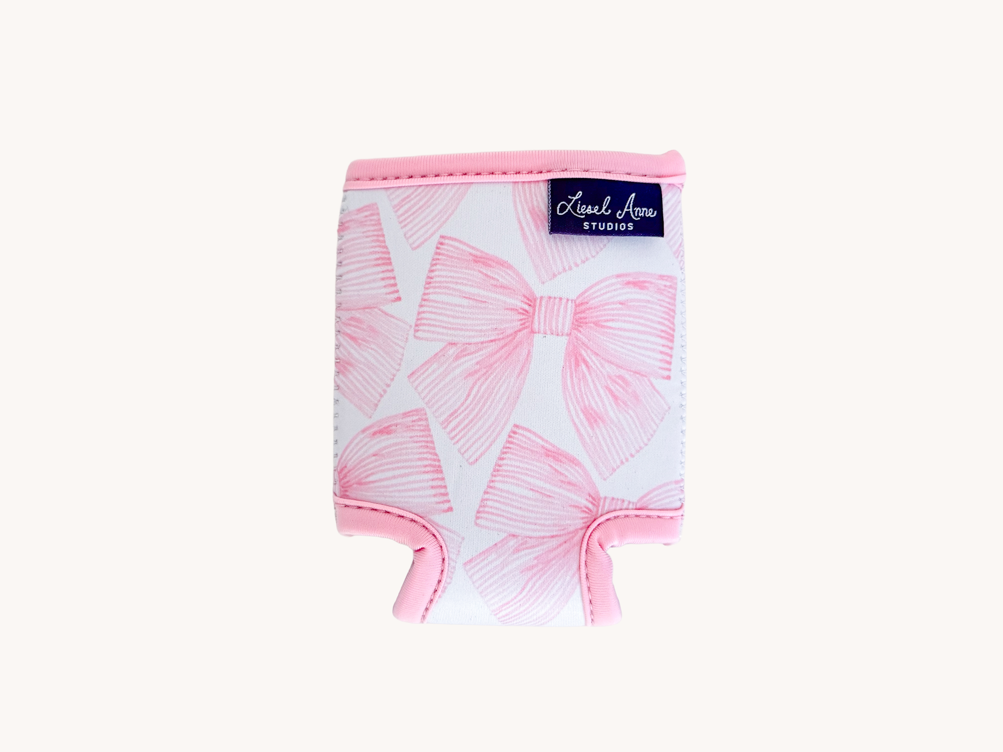 A pink and white patterned cooler or thermos with a label that says "Liesl Anne STUDIOS".