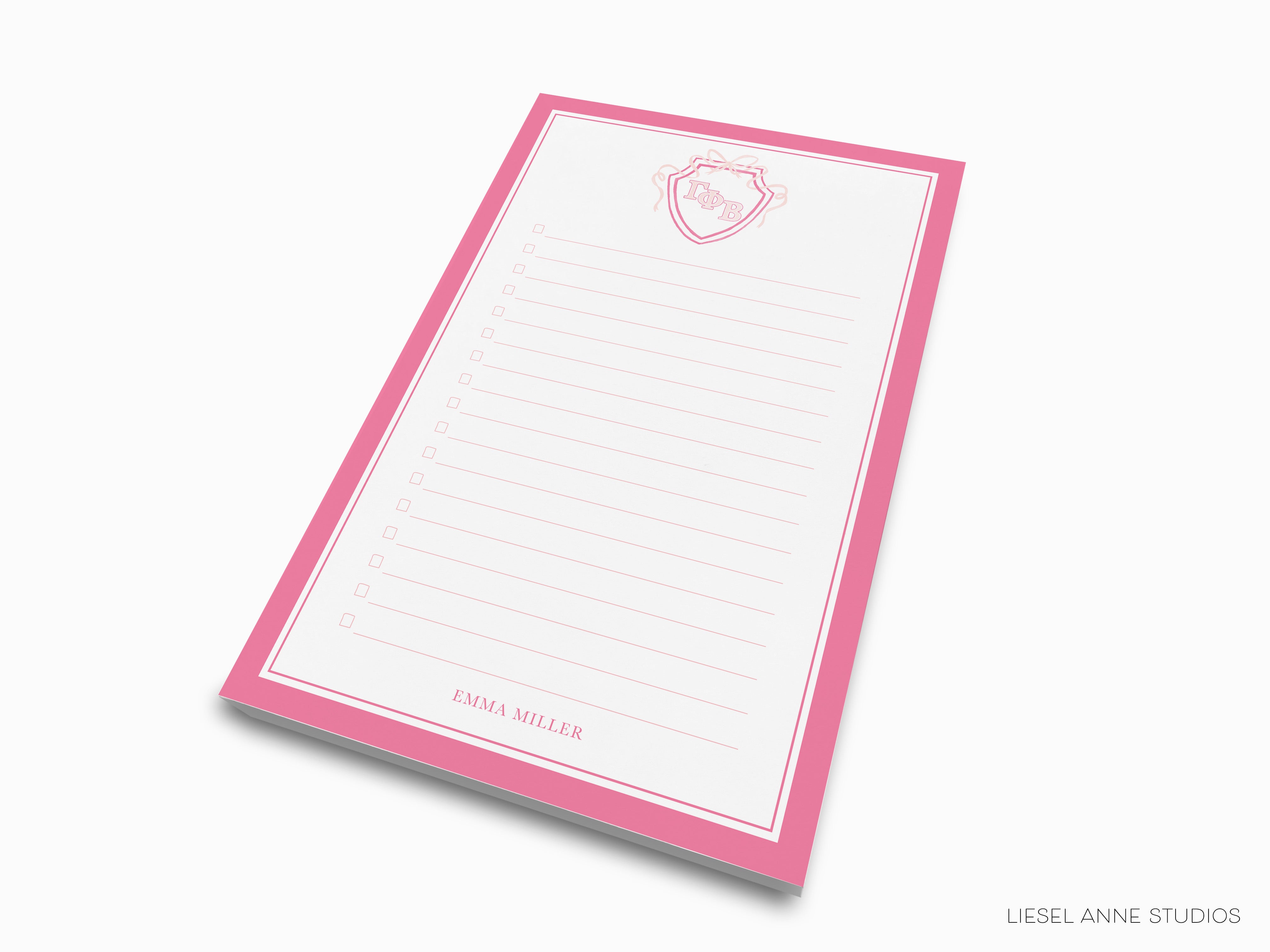 a pink and white notepad with a heart on it