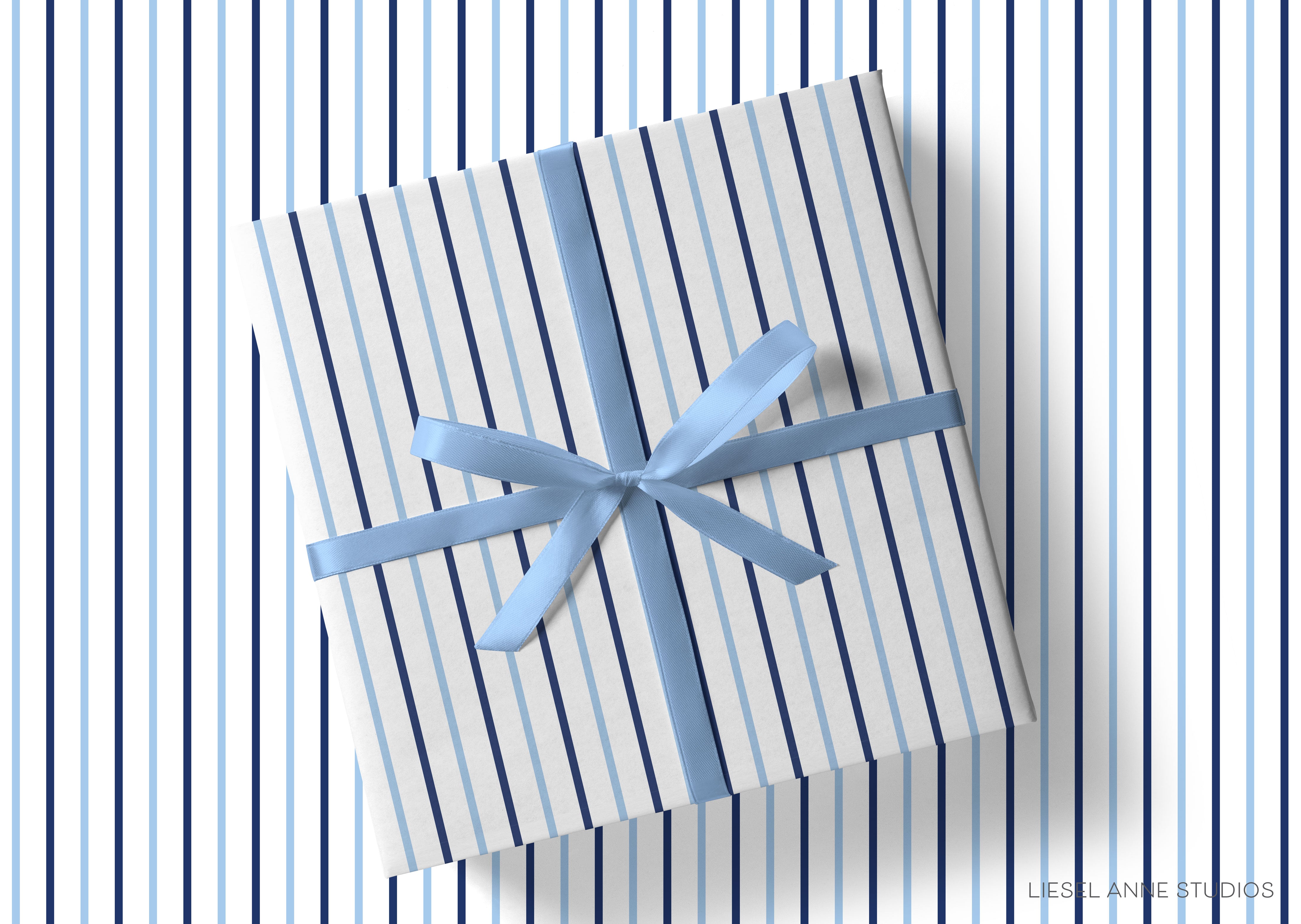 A gift box with a blue ribbon tied around it, placed on a striped background.