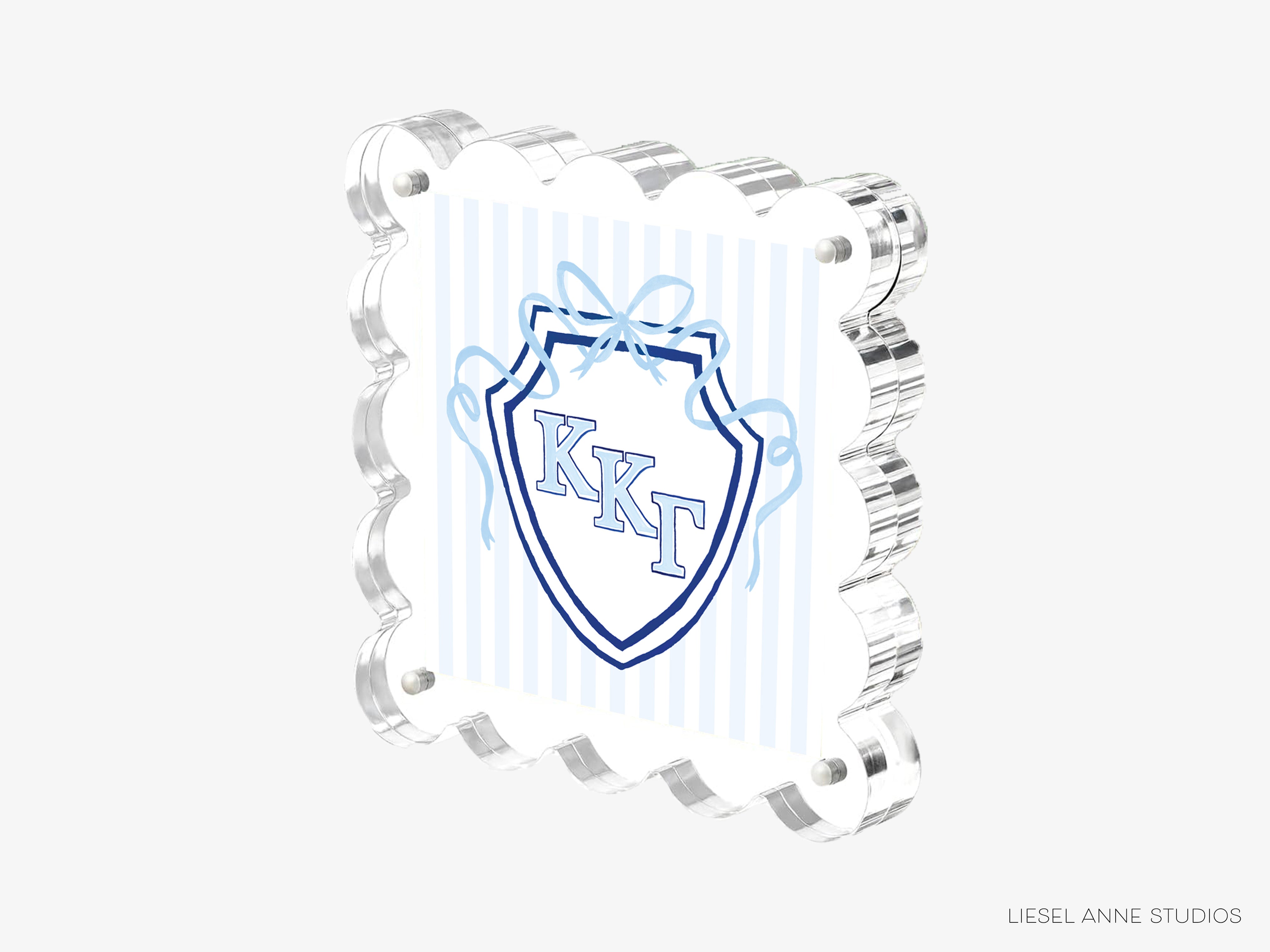 A 3D printed object with a shield-shaped design and the letters 'KKT' prominently displayed in the center.