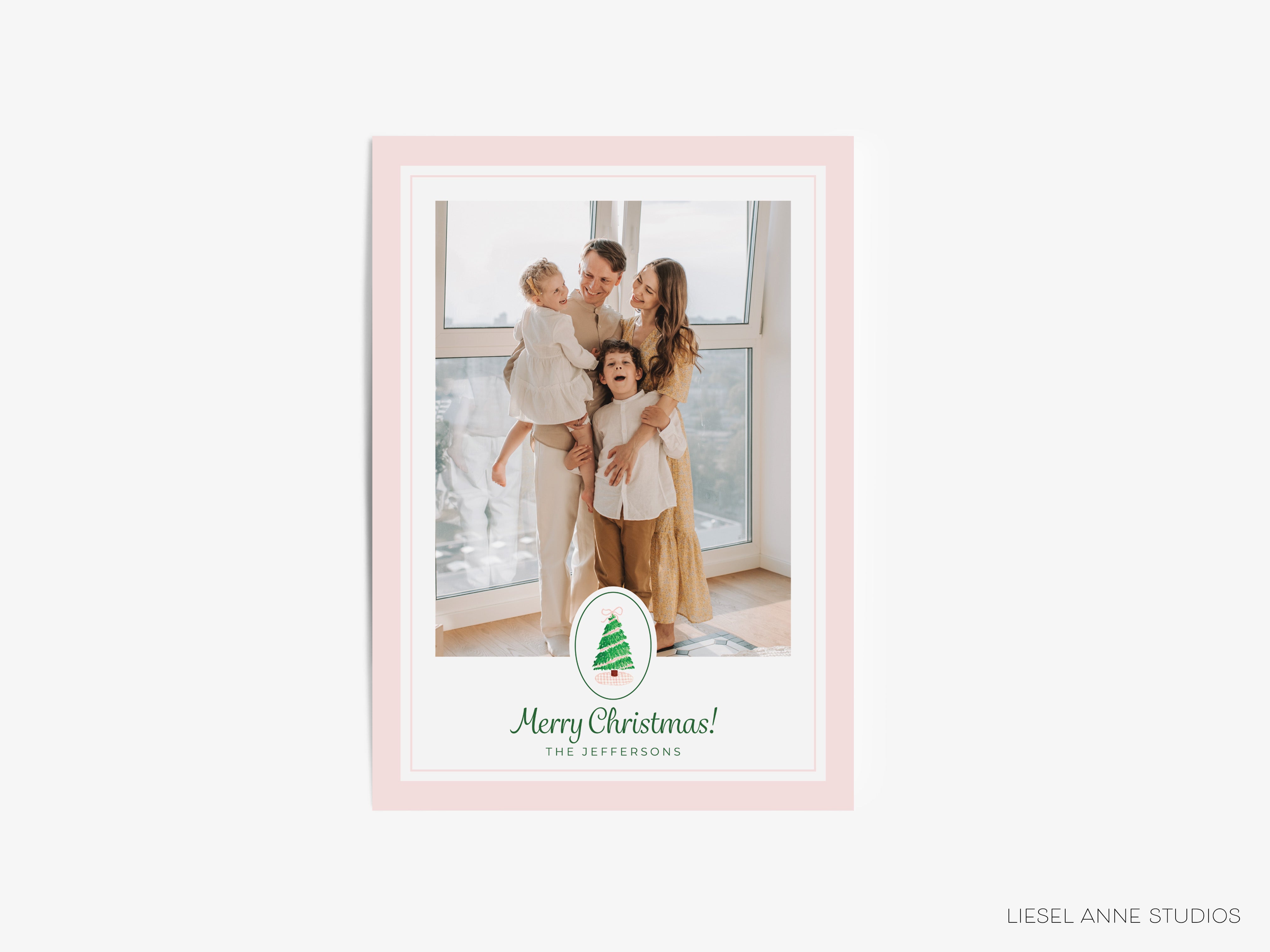 A family portrait of a family of four, with the text "Merry Christmas! The Jefferies" displayed on the image.