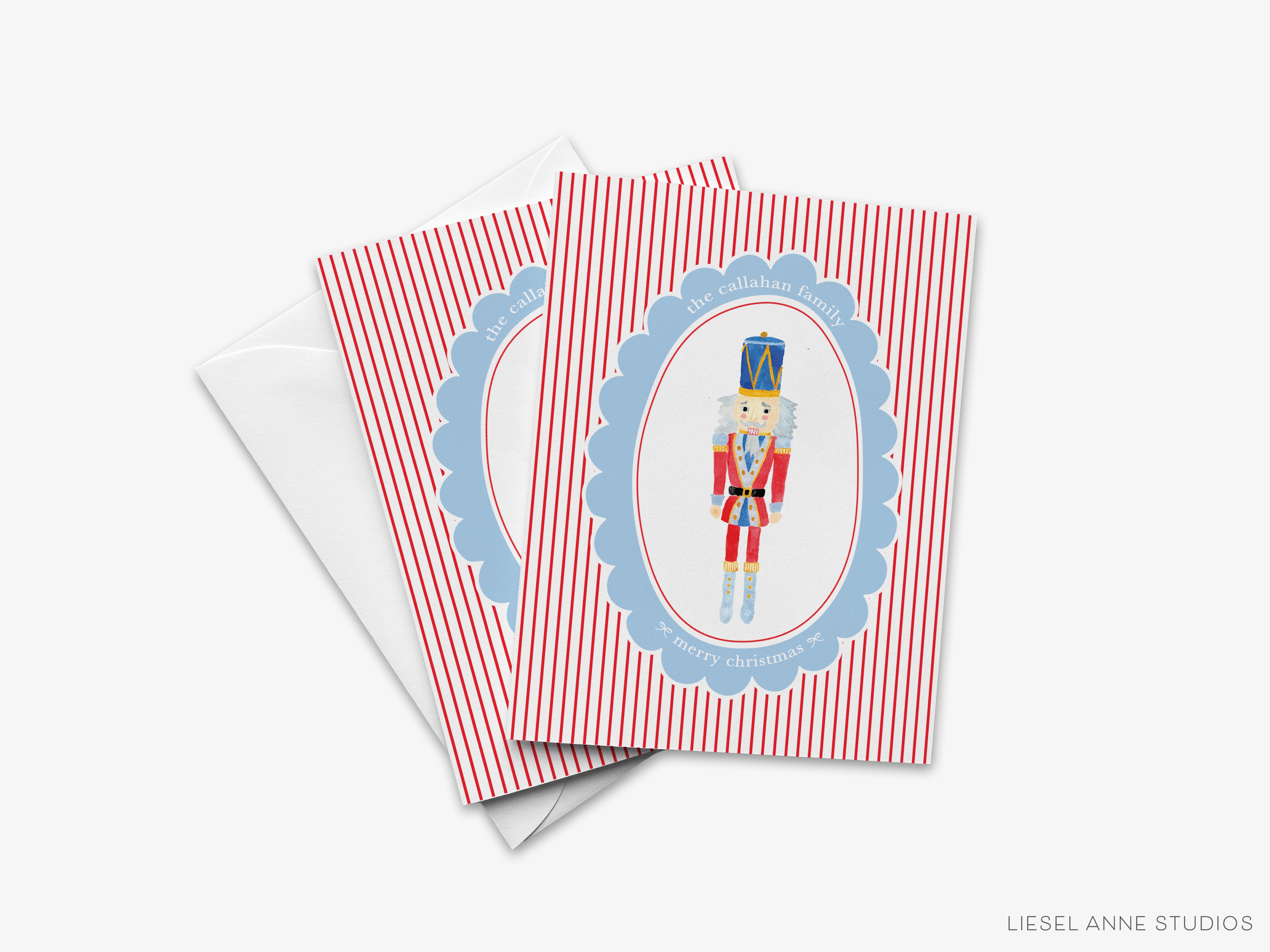 A set of greeting cards featuring a nutcracker figure in a blue and red striped frame.