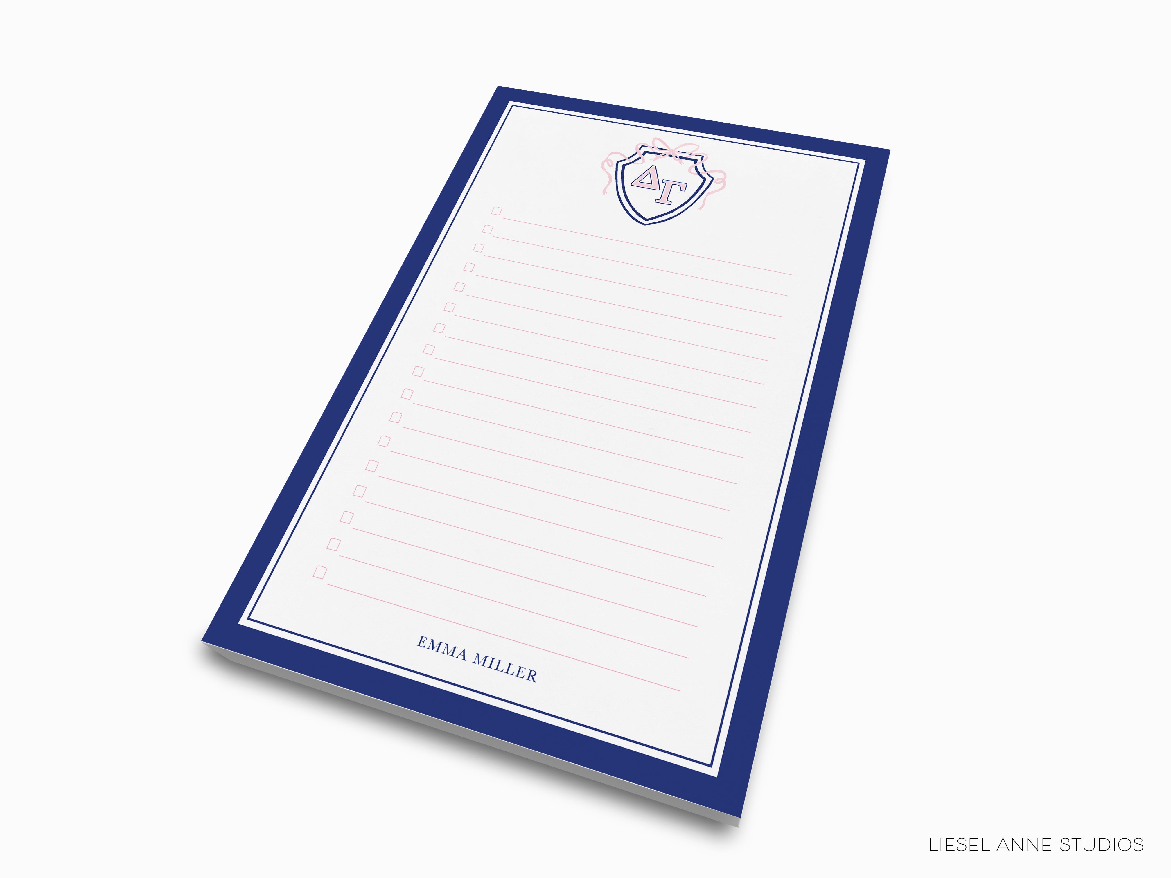 a blue and white notepad with a crest on it