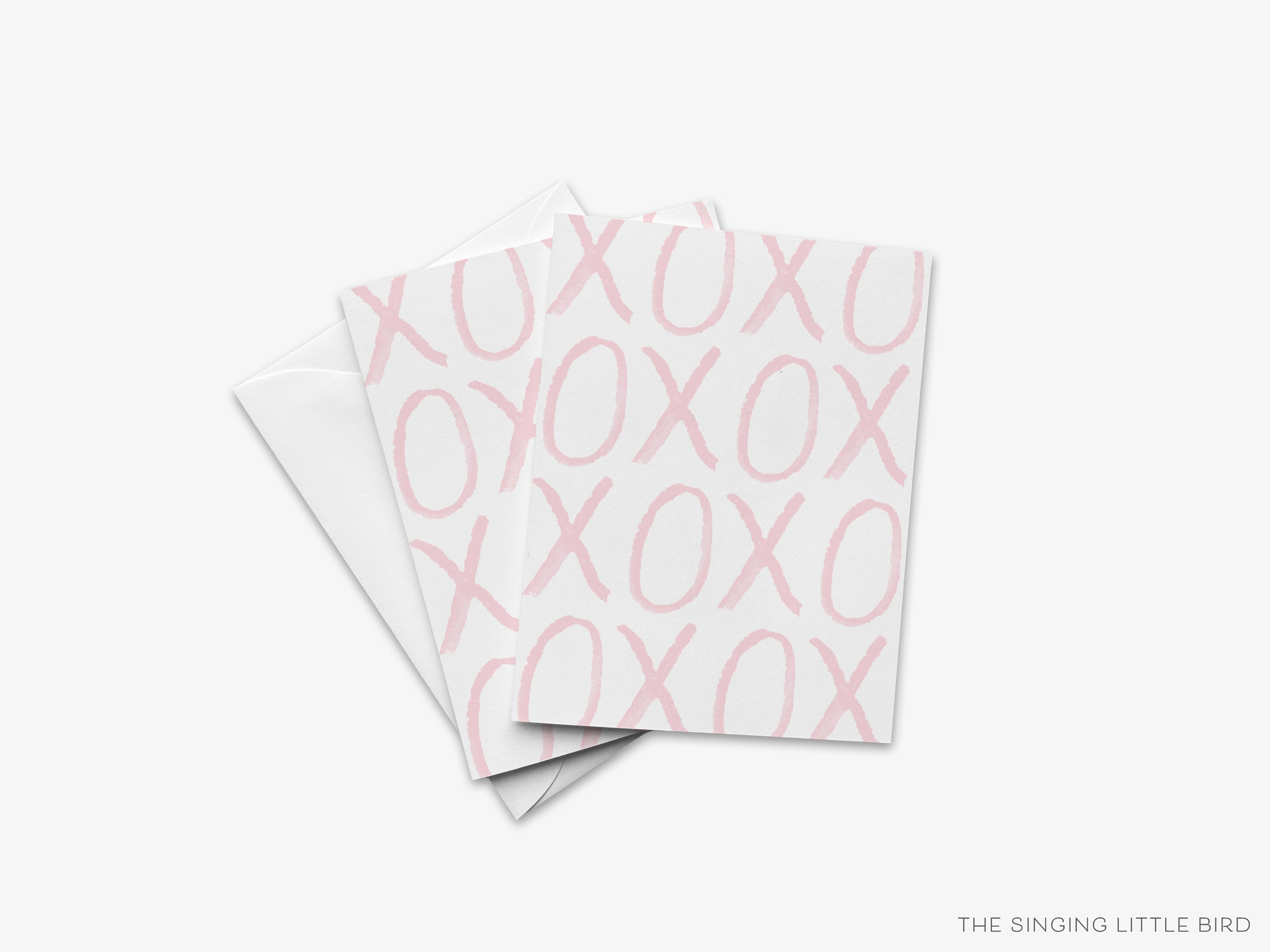 XOXO Pink Bold Greeting Card-These folded cards are 4.25x5.5 and feature our hand-painted watercolor xoxo, printed in the USA on 100lb textured stock. They come with a White envelope and make a great card for the special one in your life.-The Singing Little Bird