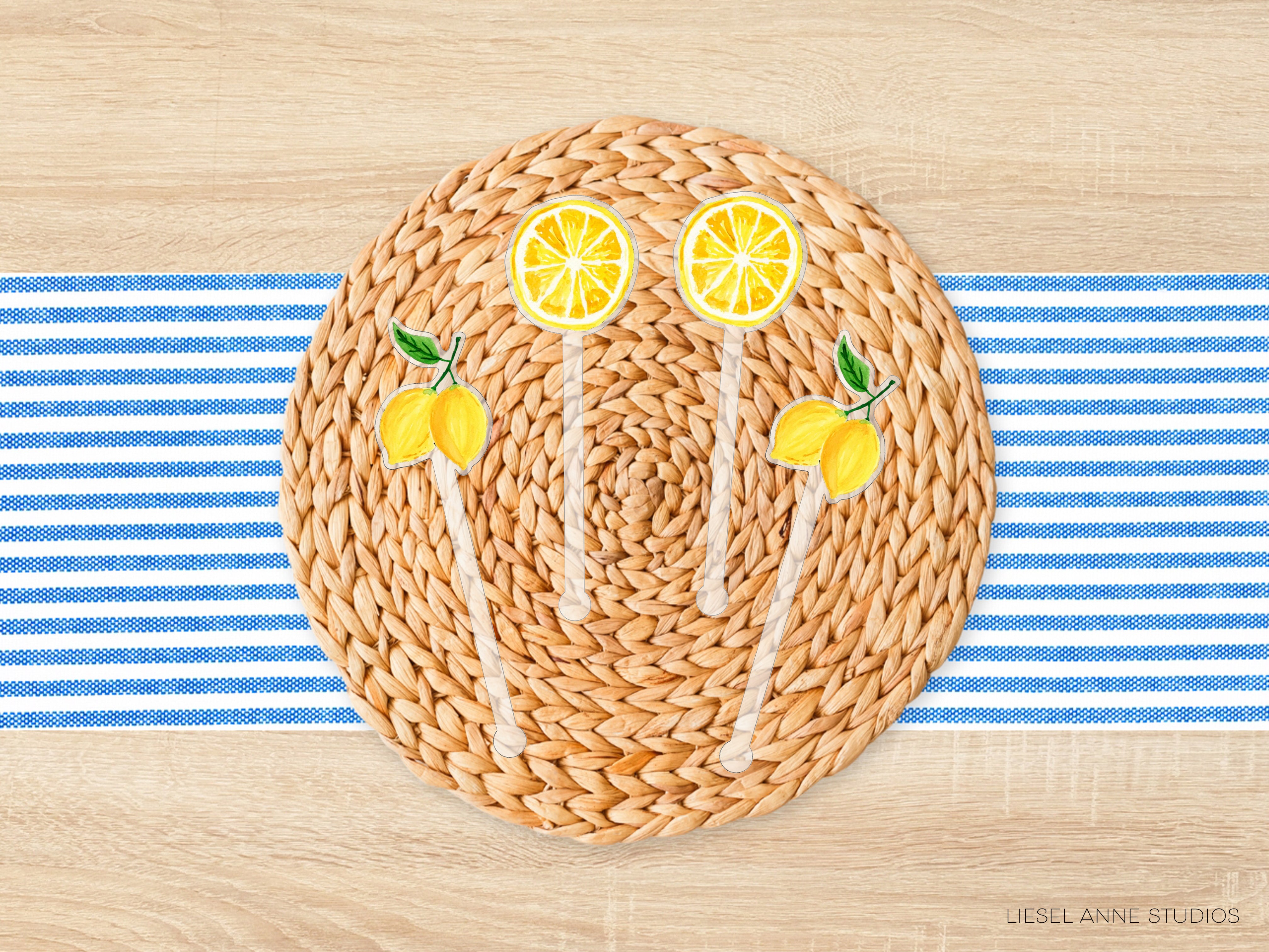 A woven placemat with lemon slices and lemons on a blue and white striped tablecloth.