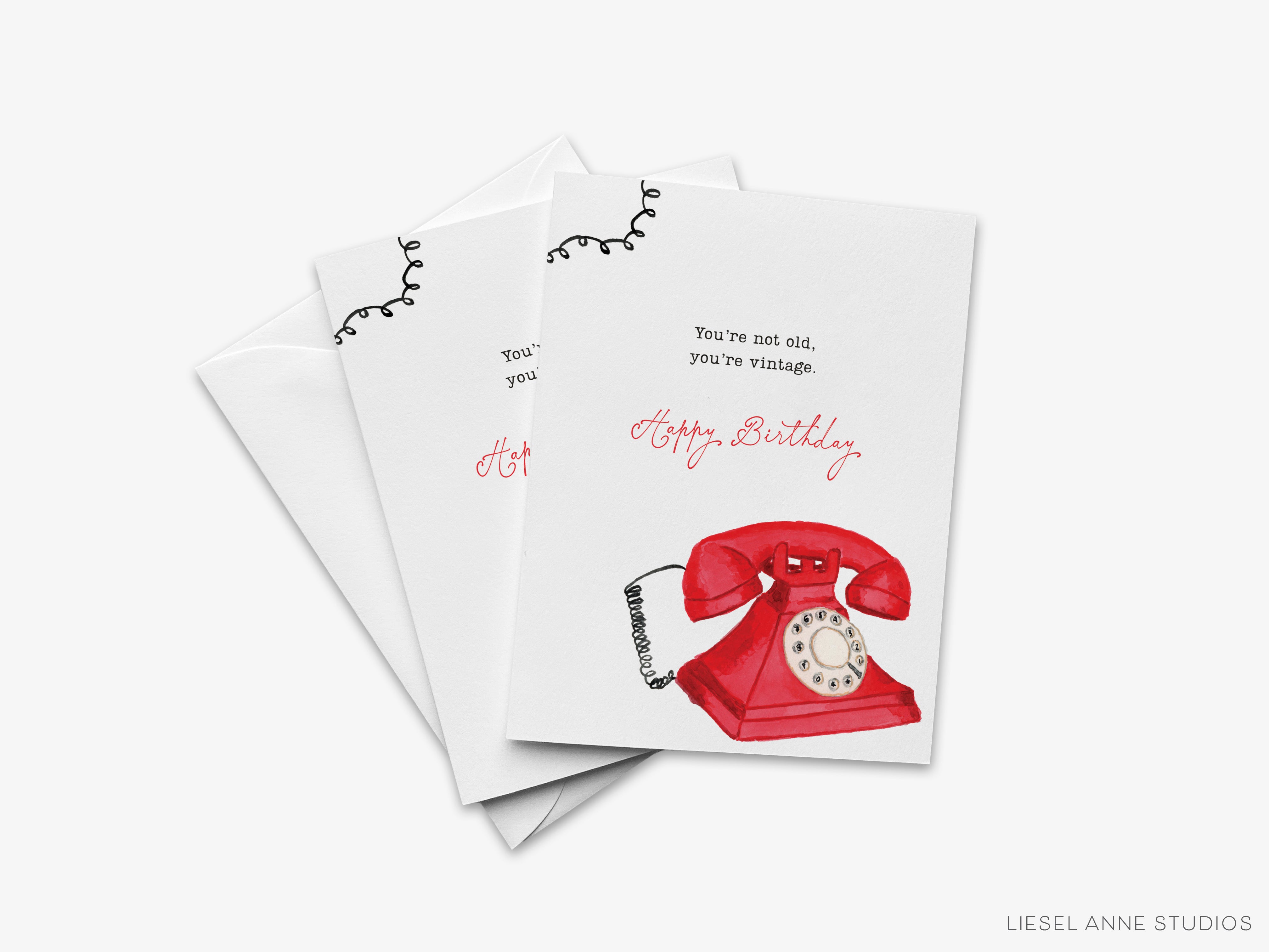 a birthday card with a red telephone illustration and a message that reads "You're not old, you're vintage."