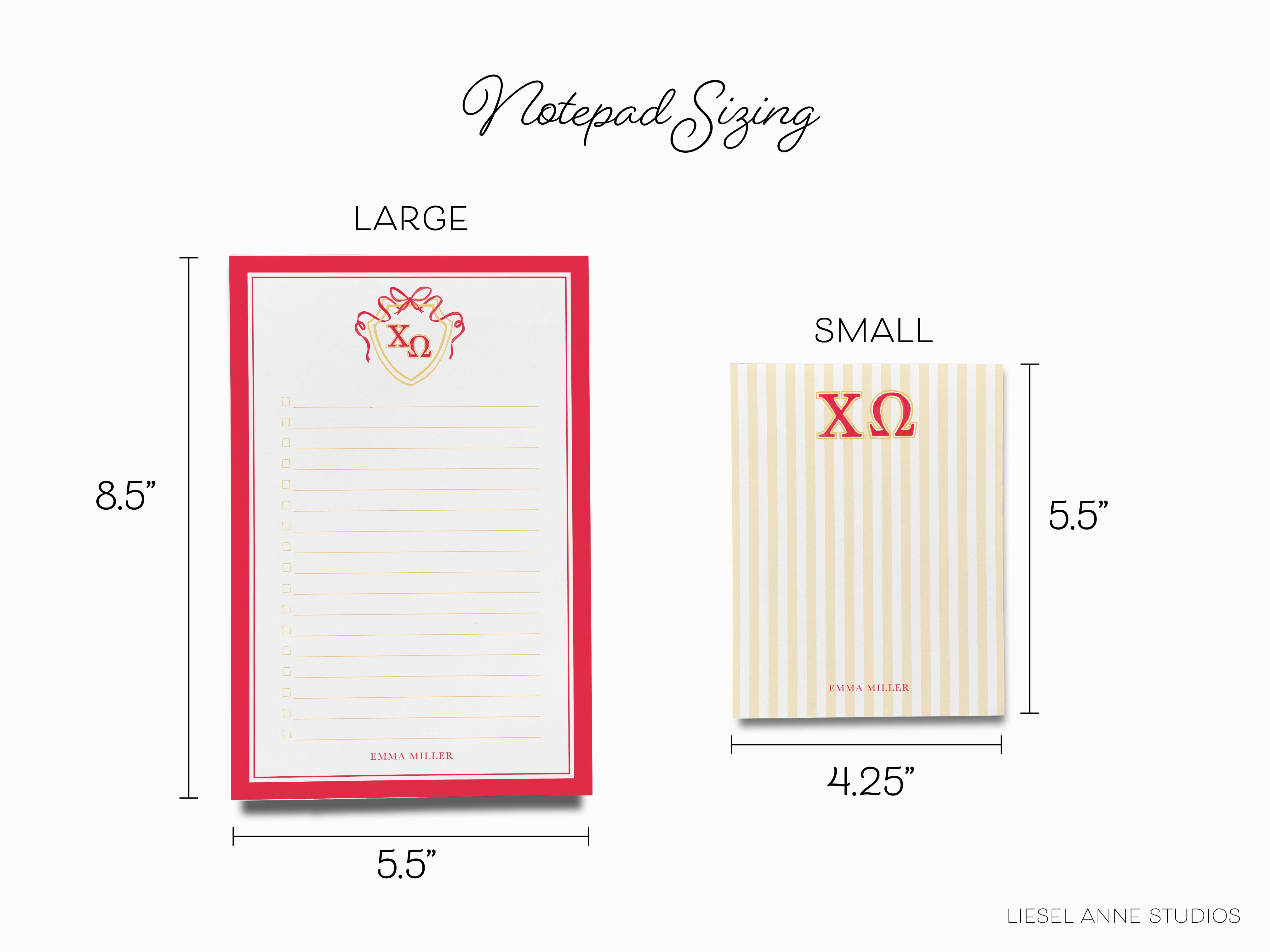 a red and white notepad with a red heart on it