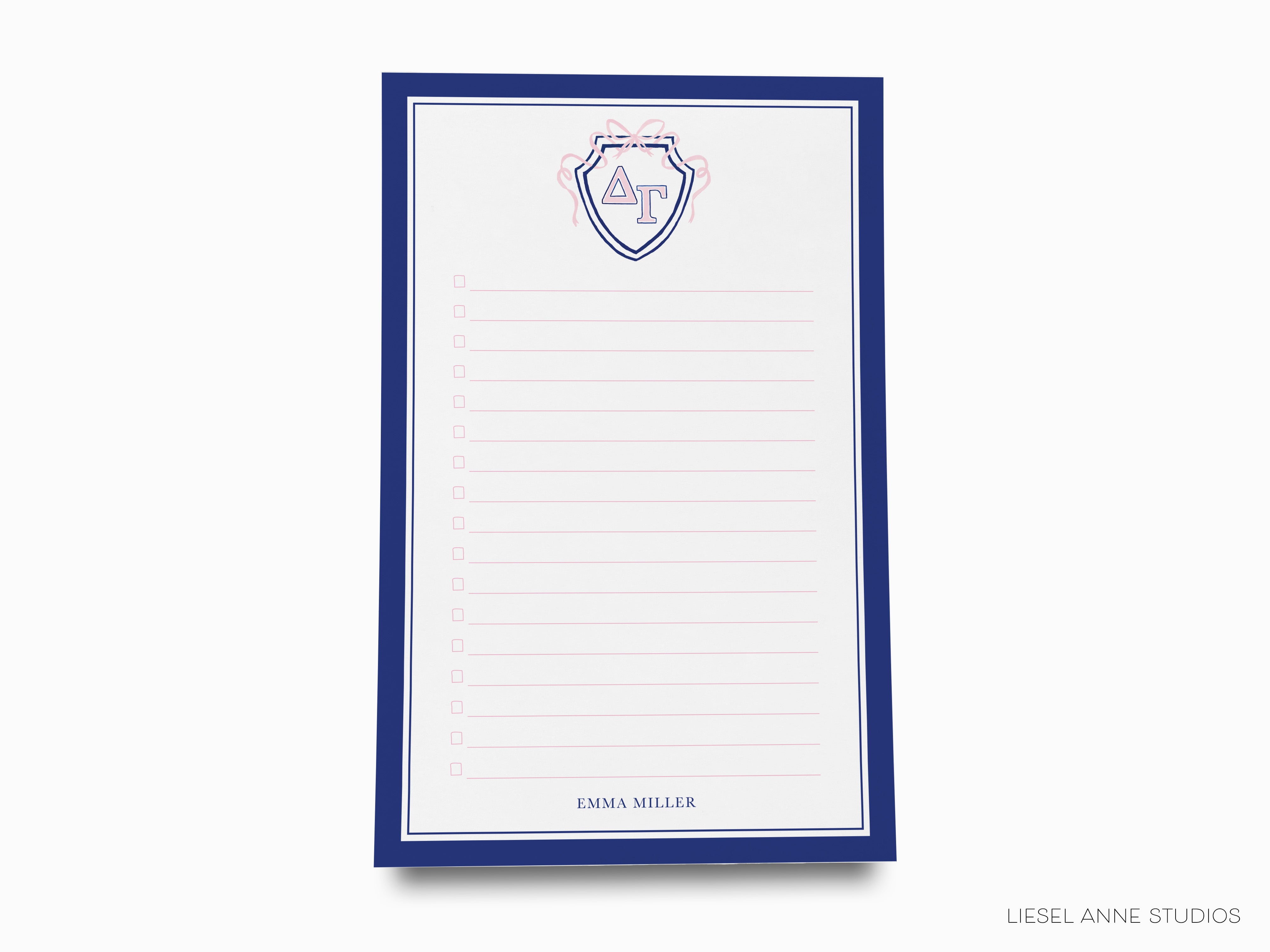 a notepad with a picture of a shield on it
