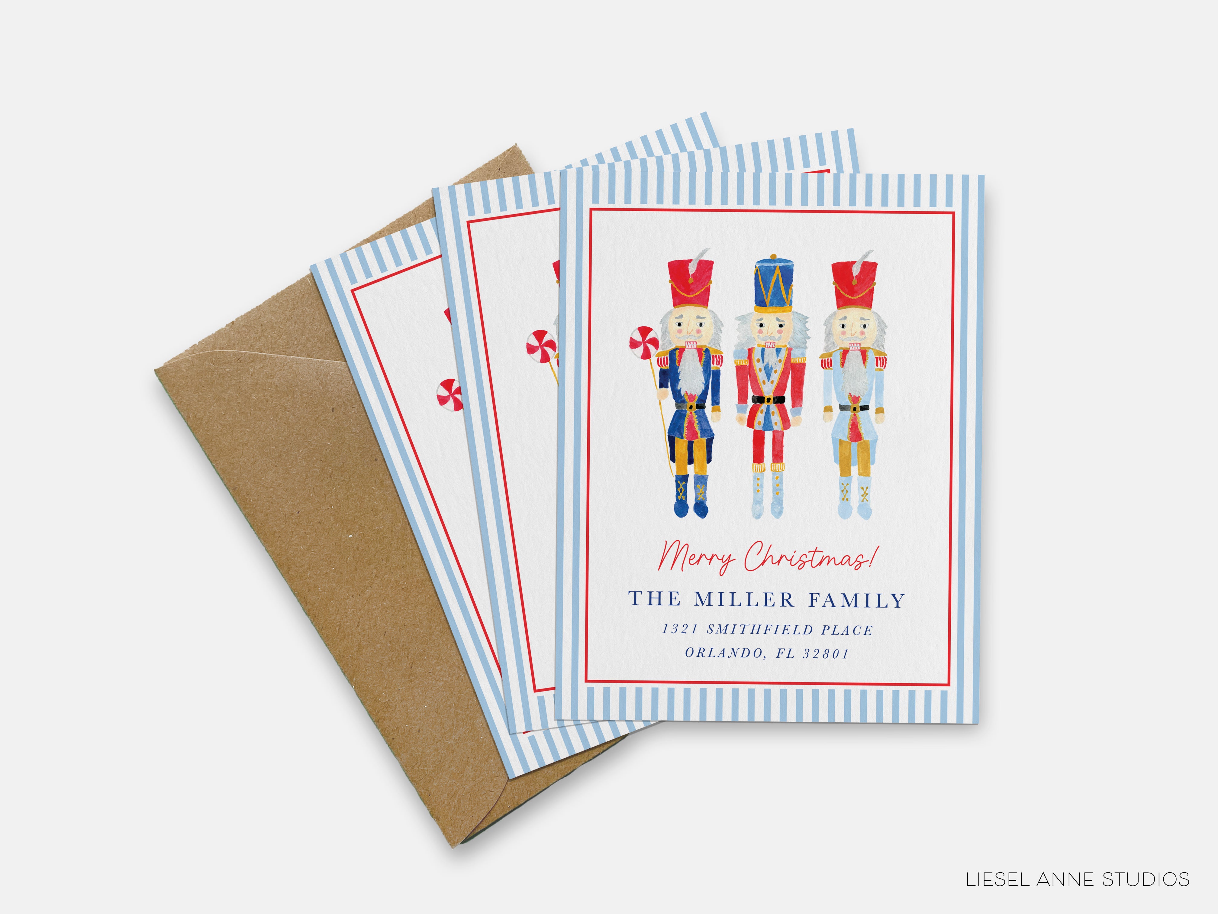 A set of holiday greeting cards featuring nutcracker characters, with a brown envelope visible in the background.