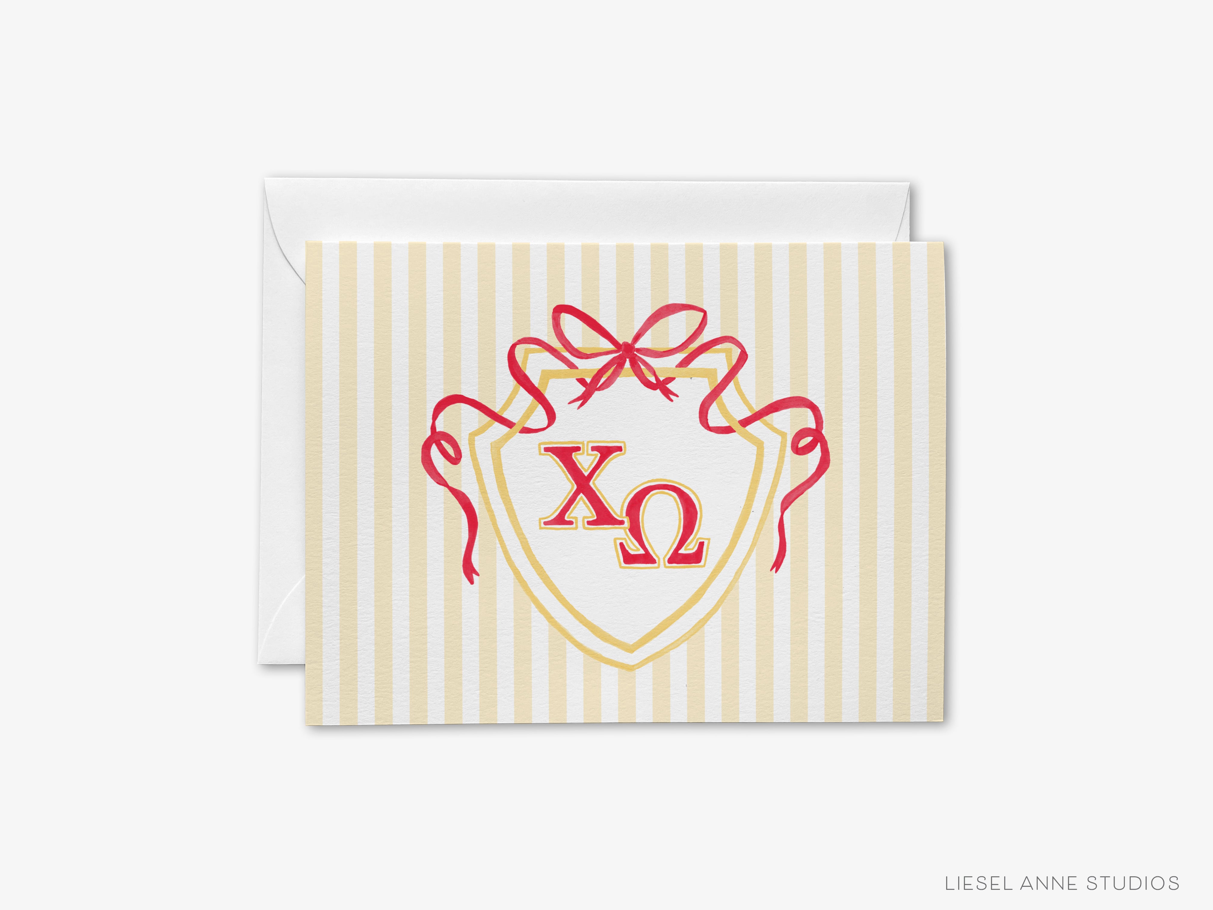 A greeting card with a shield design featuring the Greek letters 'ΓΓΓ' and a red ribbon.